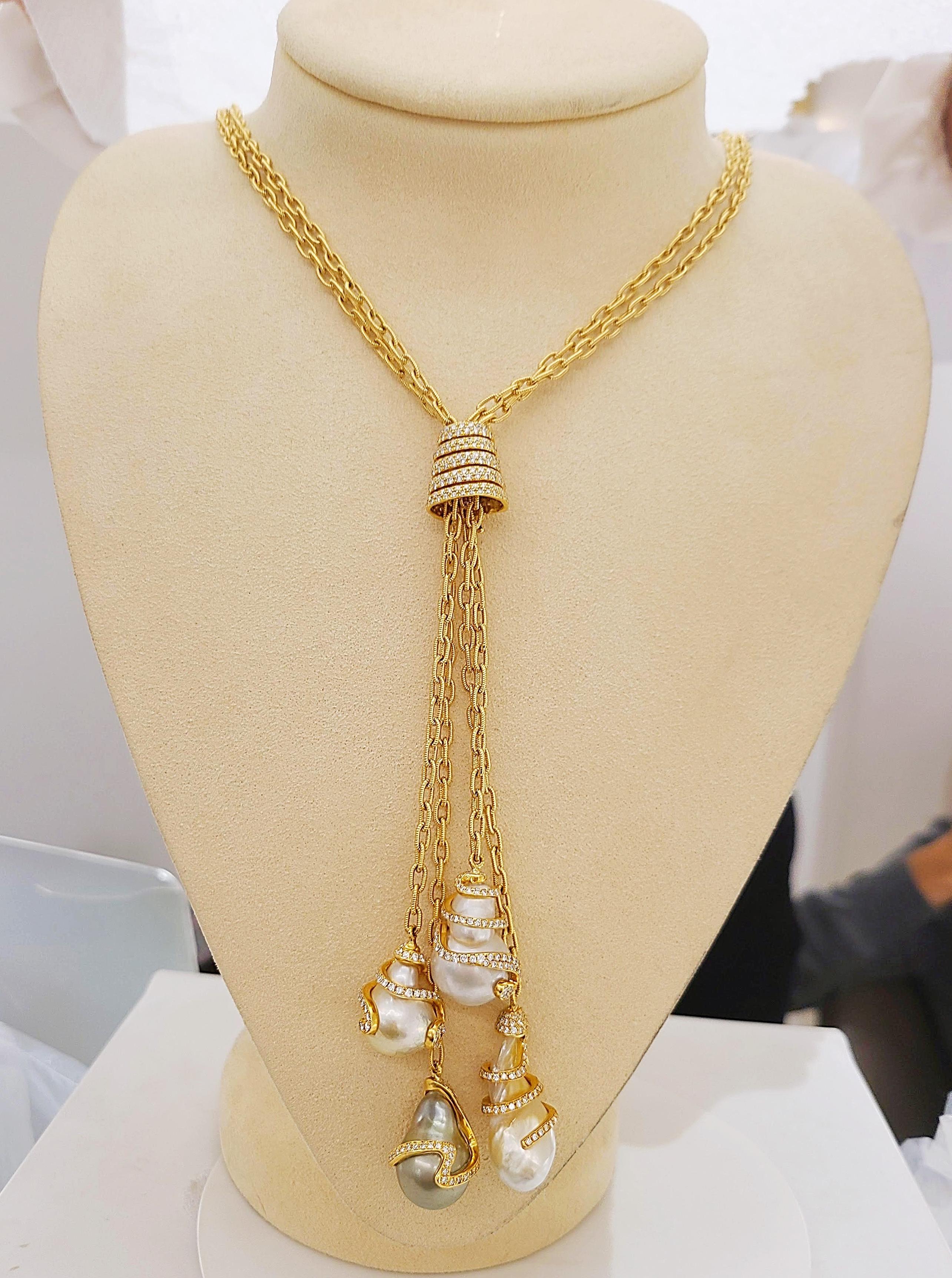 Rare organic pearls are Yvel's signature design. Cellini Jewelers NYC presents their 18 karat yellow gold necklace with four Baroque South Sea Pearls. The 38