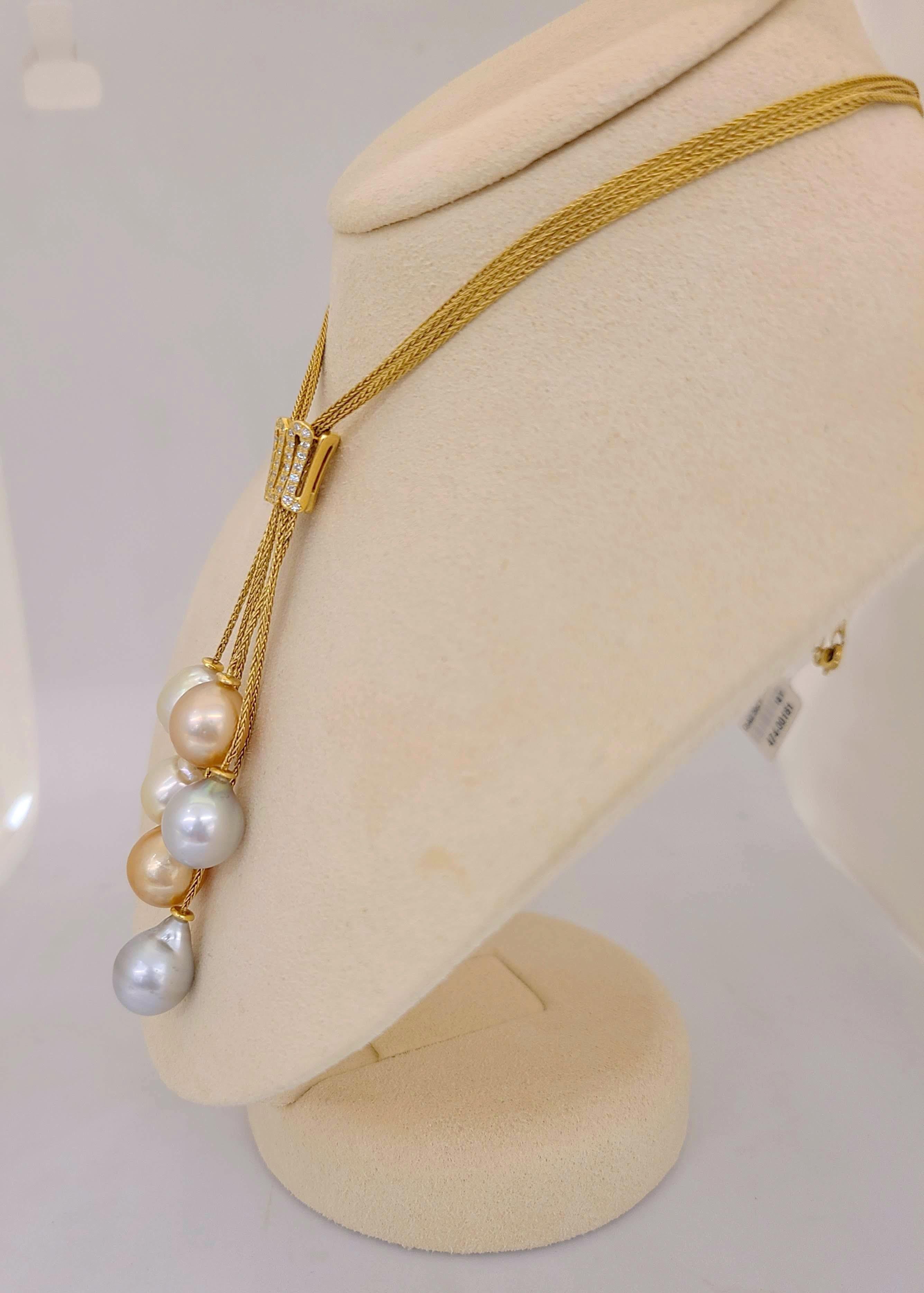 Rare organic pearls are Yvel's signature design. Cellini Jewelers NYC presents their 18 karat yellow gold necklace with six multi color drop shaped South Sea Pearls. The 23