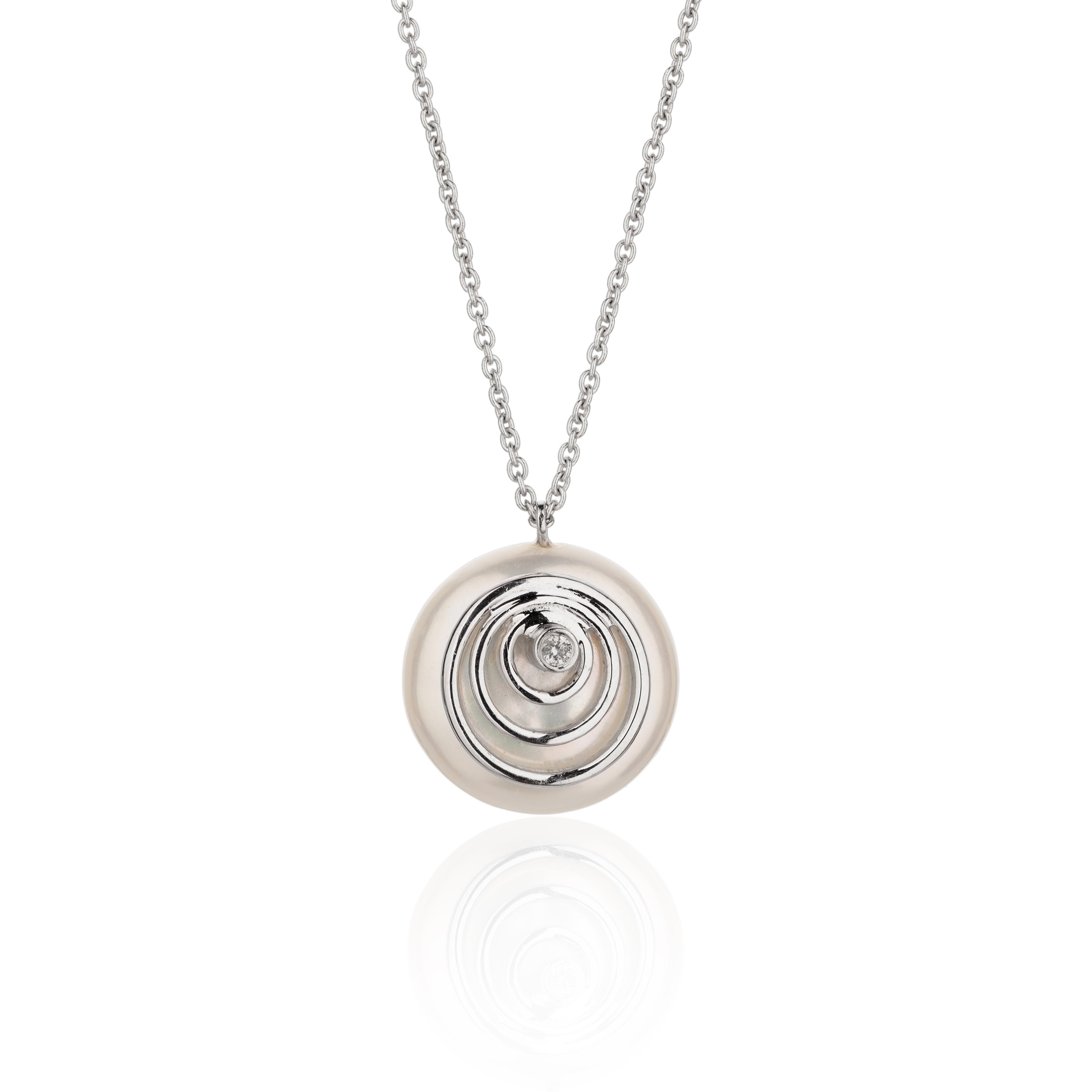 The Biwa Collection’s delicate 18K white gold necklace artfully displays a 15 by 16 mm round flat freshwater coin pearl, complemented by a single 0.02 ct. diamond. This elegant piece is a modern take on classic sophistication, capturing the quiet