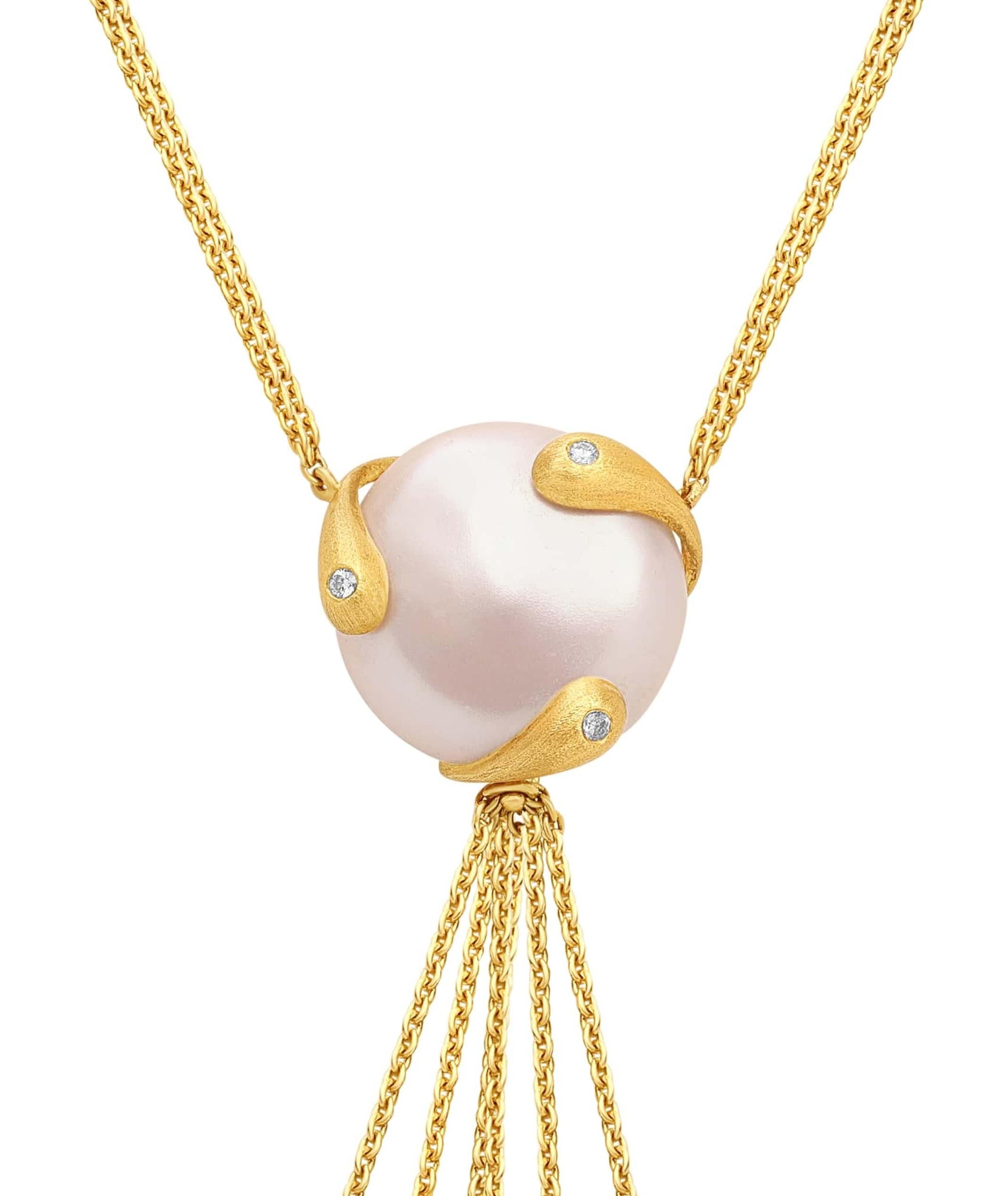 This enchanting 18k yellow gold necklace from Yvel’s Biwa Collection cascades with Freshwater pearls, each ensconced in golden spirals reminiscent of the timeless art of Japanese adornment. Dainty diamonds accentuate where gold meets pearl, leading