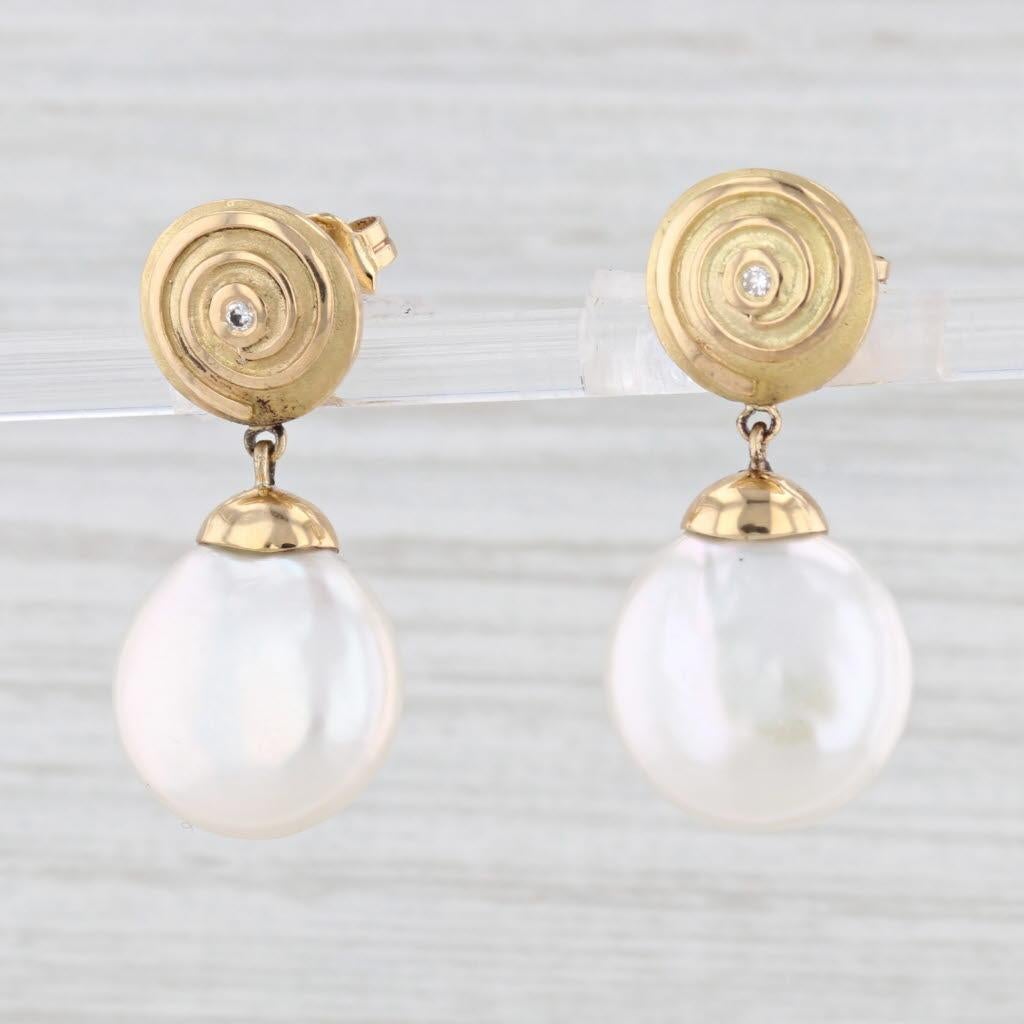 Gemstone Information:
- Cultured Pearl -
Size - 13.25 mm 
Cut - Round Coin Shape
Color - White

- Natural Diamonds -
Total Carats - 0.02ctw
Cut - Round Brilliant
Color - G - H
Clarity - VS1 - VS2

Metal: 18k Yellow Gold
Weight: 9.5 Grams 
Stamps: