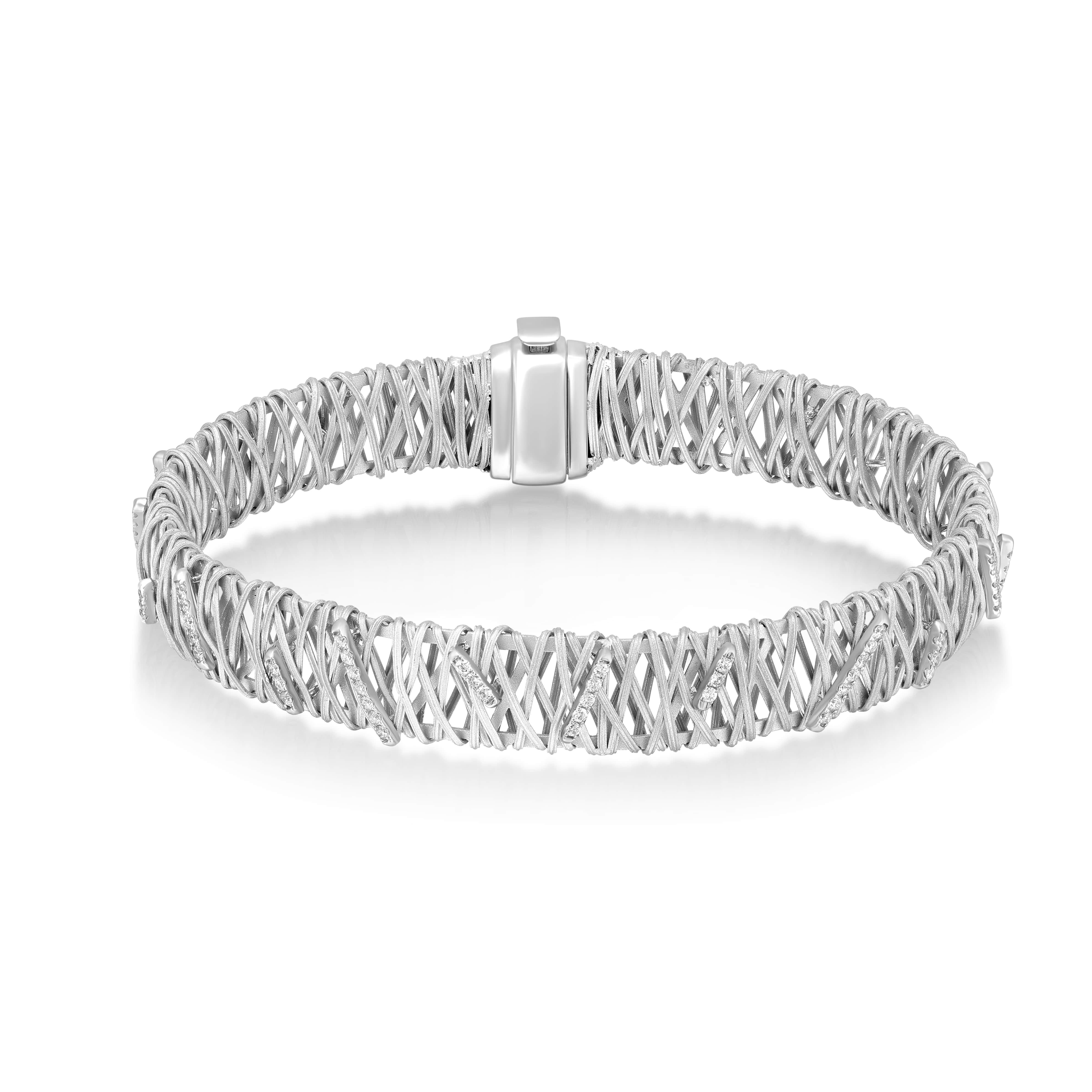 The Diamond Woven Bracelet is a sophisticated display of artisanal finesse. In 18K white gold, this bracelet features a complex woven design interspersed with 0.59 ct. of brilliant white diamonds, reminiscent of the meticulous weaving traditions of