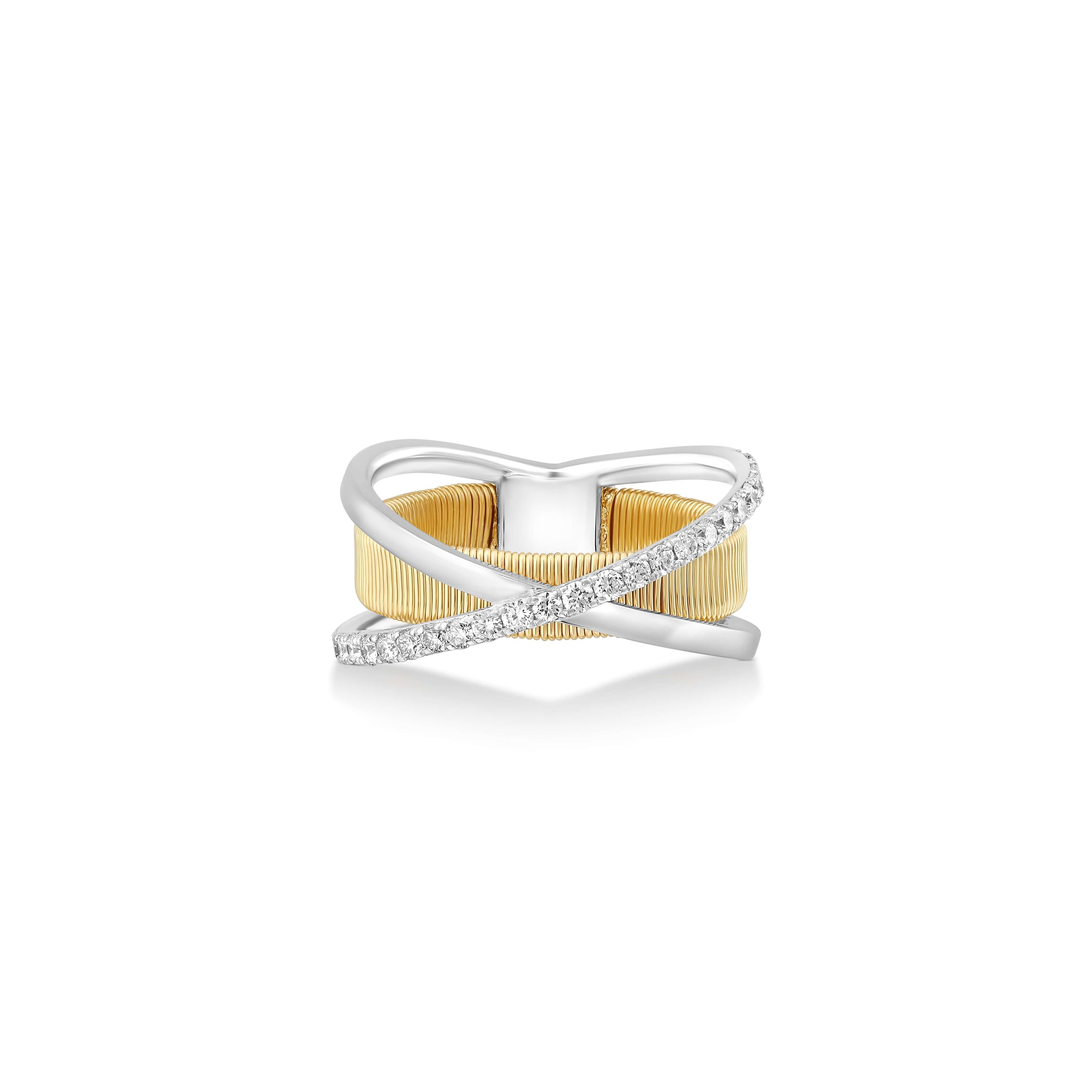 This Two-Tone Textured Diamond Ring is a celebration of the rich tapestry of Ethiopian culture, masterfully translated into Yvel’s fine jewelry language. Set in 18K white and yellow gold, the ring is adorned with 0.38 ct. of sparkling white