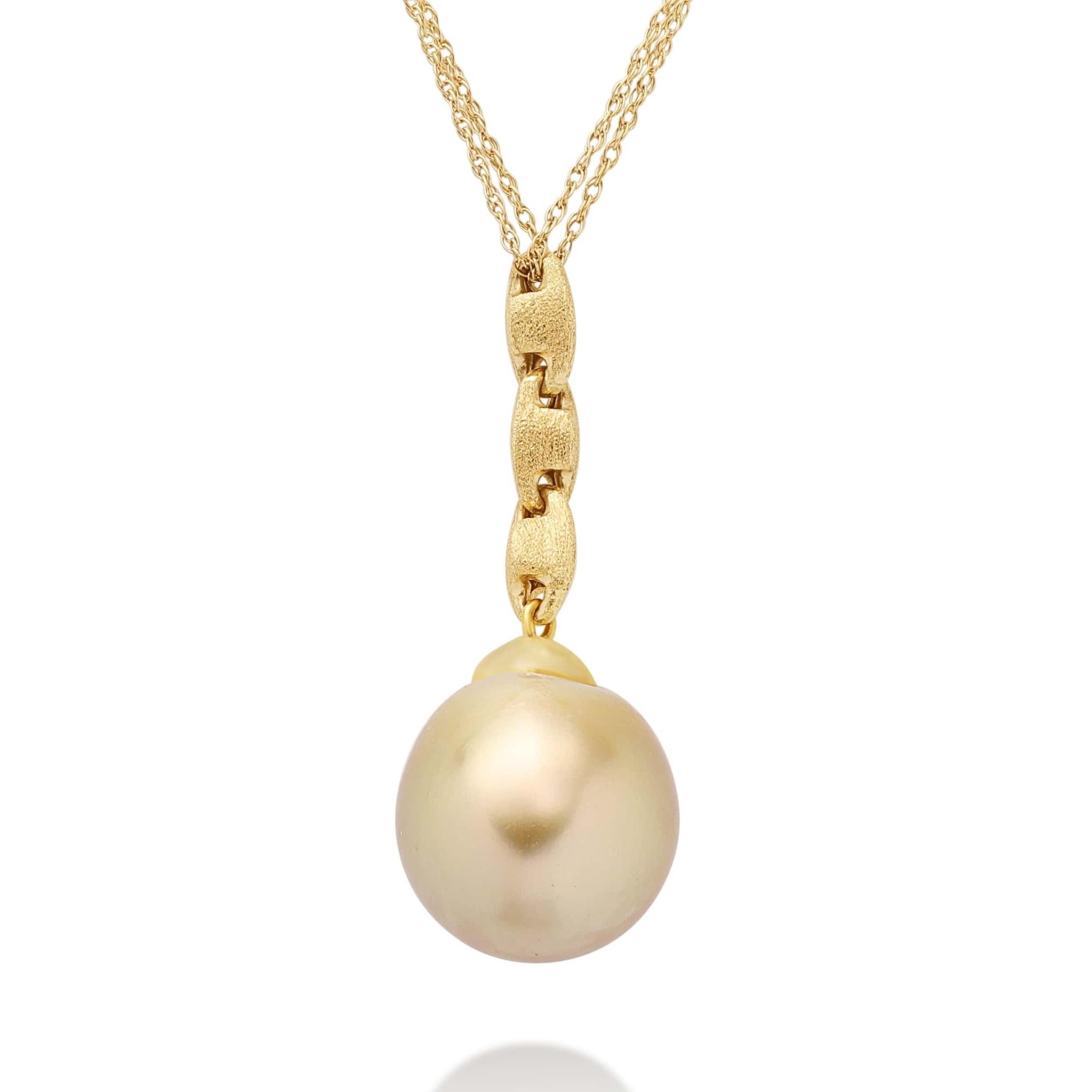 The South Sea Pearl Pendant Necklace is a resplendent piece from Yvel's Golden Brown Collection, showcasing a magnificent 14 by 16 mm. golden South Sea pearl. This necklace, crafted in 18K yellow gold, allows the pearl to take center stage, its