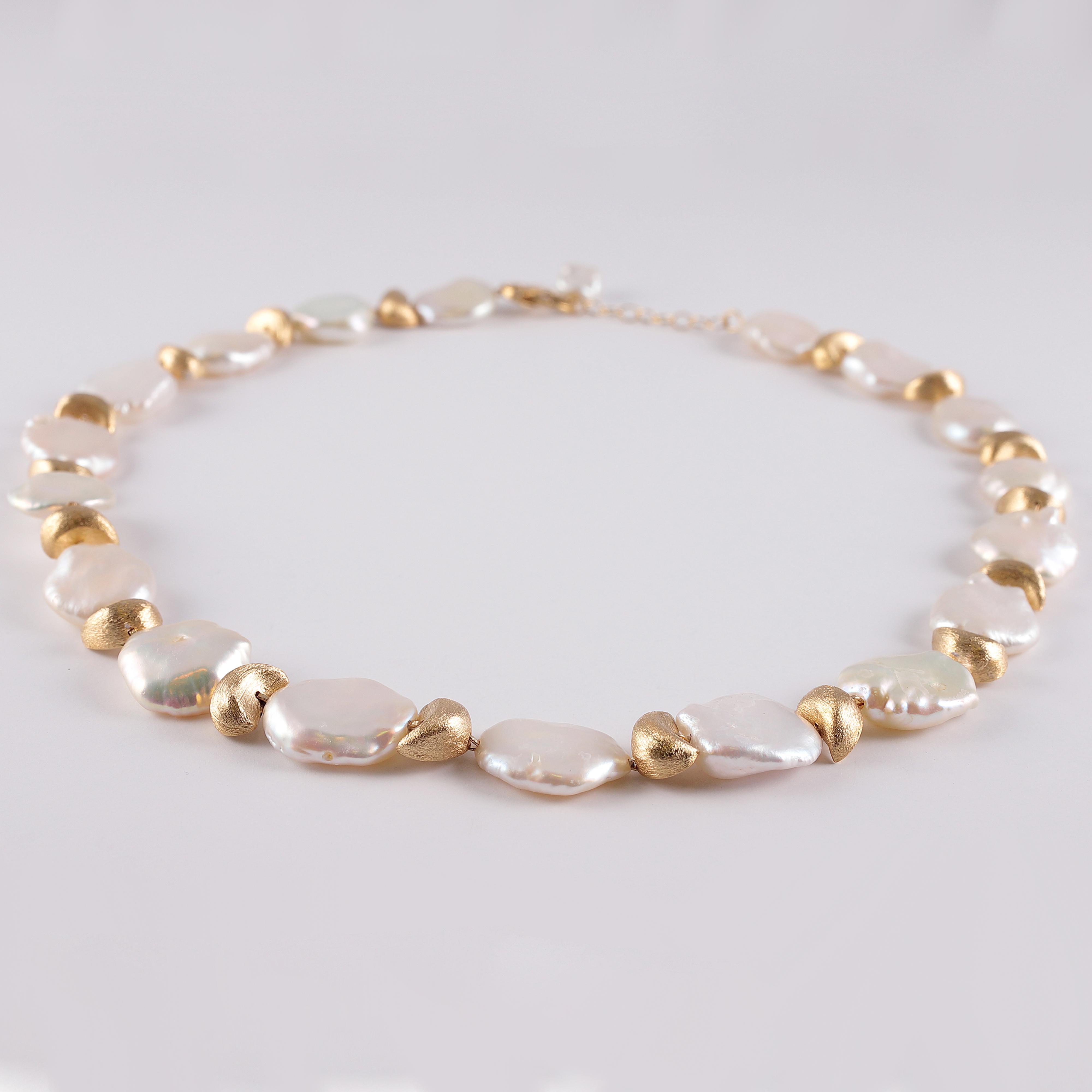  In 18 karat gold, this necklace is perfect for jeans or a dress!  The white Keshi pearls measure approximately 15.00 mm - 16.00 mm each and alternate with textured yellow gold nuggets, all secured with an over sized, lobster clasp  - so easy to get