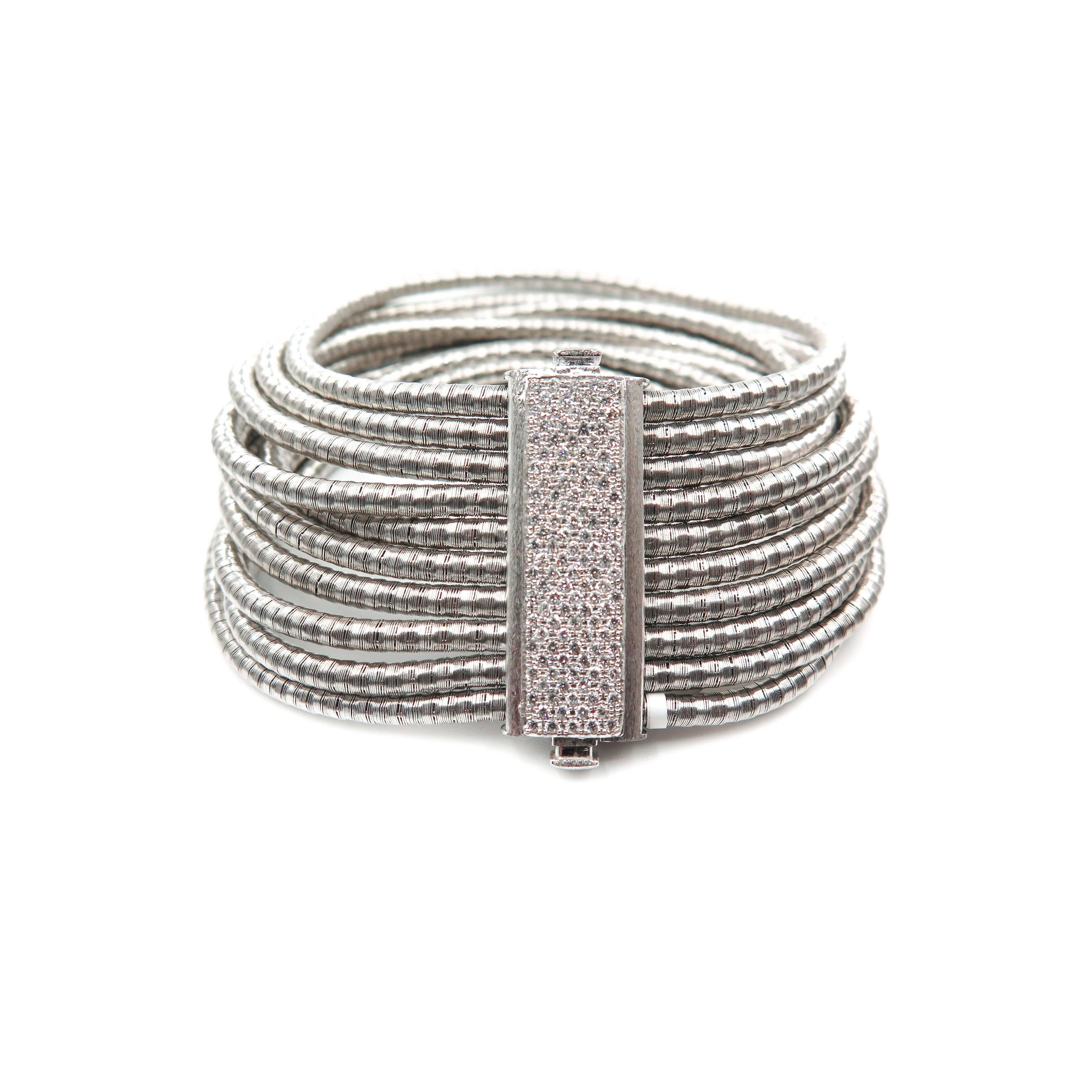 Experience and feel the softness of this gorgeous bracelet, designed by layering 10 individual strands of solid 18k white gold rounded links and finished with the beautiful detail of a magnificent diamond clasp.
Created by Yvel and expertly crafted