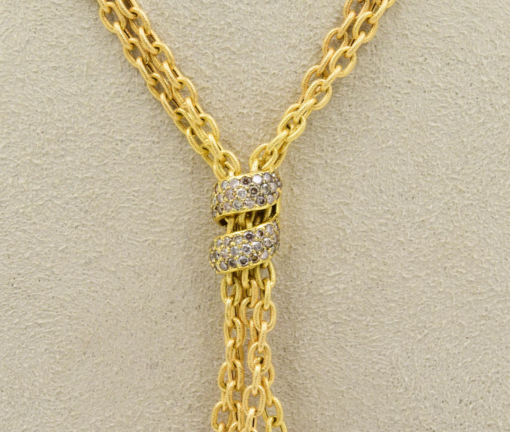 This beautiful Yvel necklace has recently been traded in.  The link style chain has a double-strand design with milgraine oval links.  The necklace has an adjustable length with a fine lobster clasp.  The pearls are set underneath a loop of