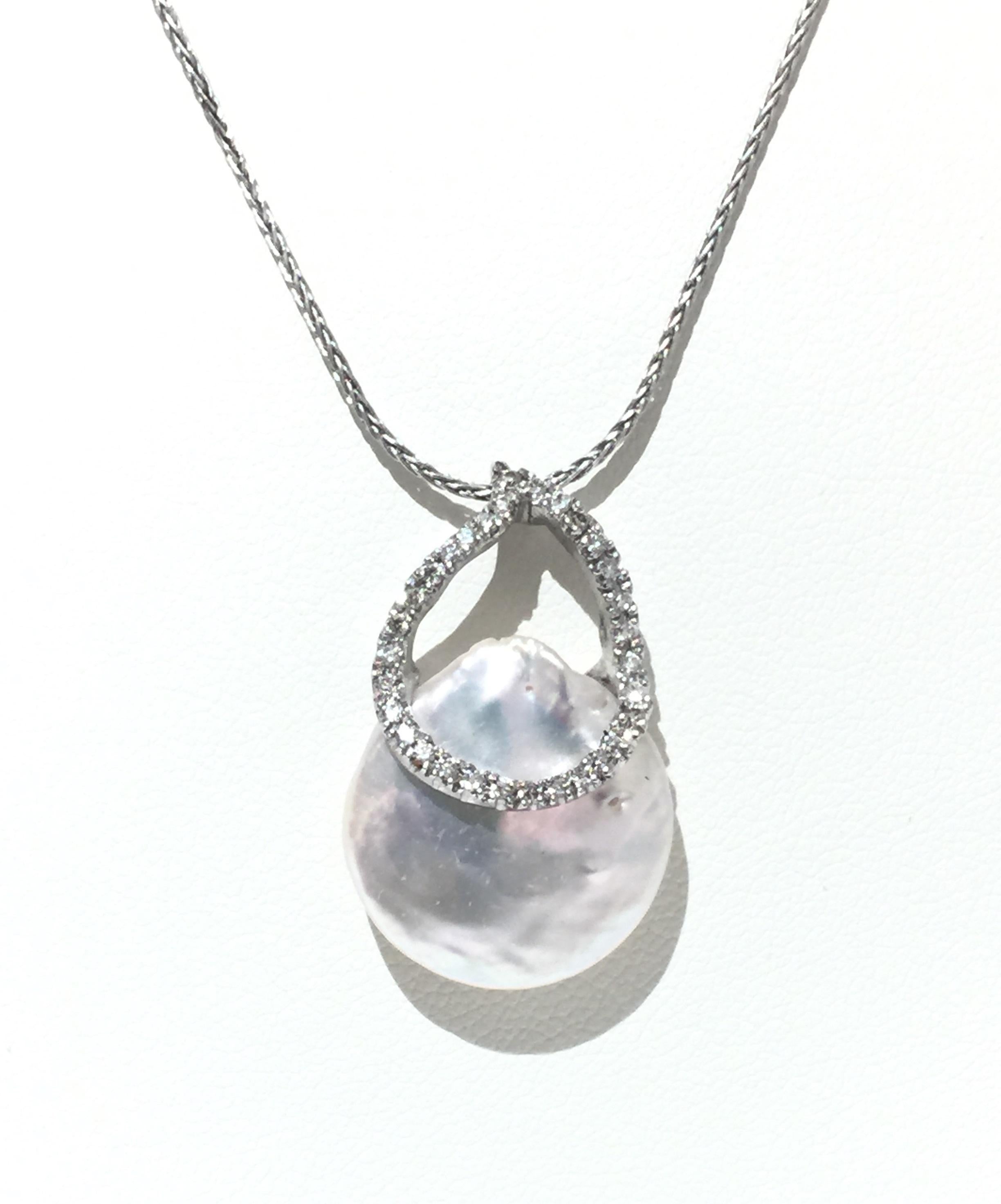 Yvel Pearl and Diamonds Necklace.
18k White Gold 
Pearl 
Diamonds 0.25ctw
Length 16 inches 
N1TIPAW