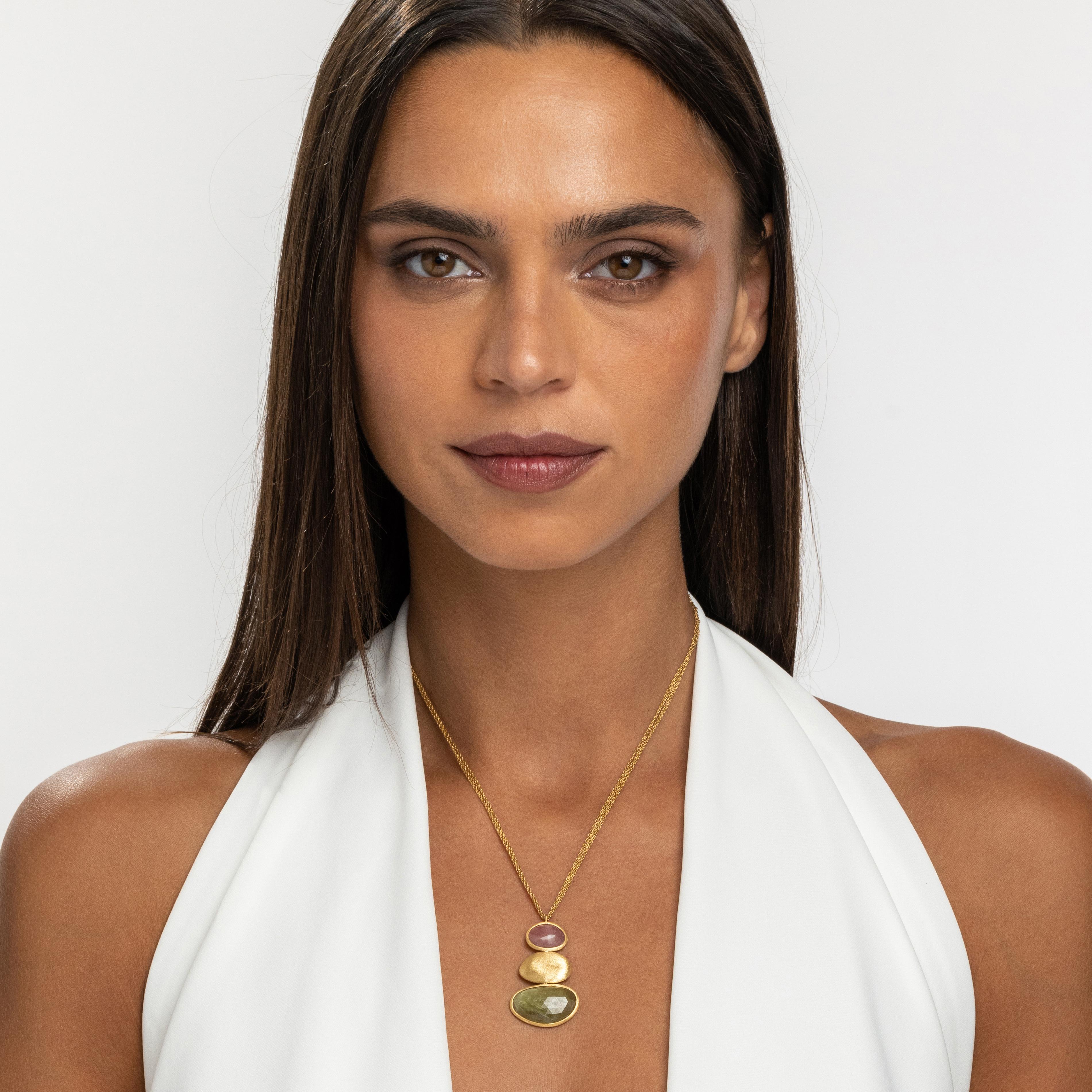 The Rainbow Collection brings forth this exquisite necklace, elegantly set with 24.00 carats of natural sapphire and aquamarine, interspersed with handmade 18K yellow gold nuggets. This piece perfectly embodies the African inspiration of the