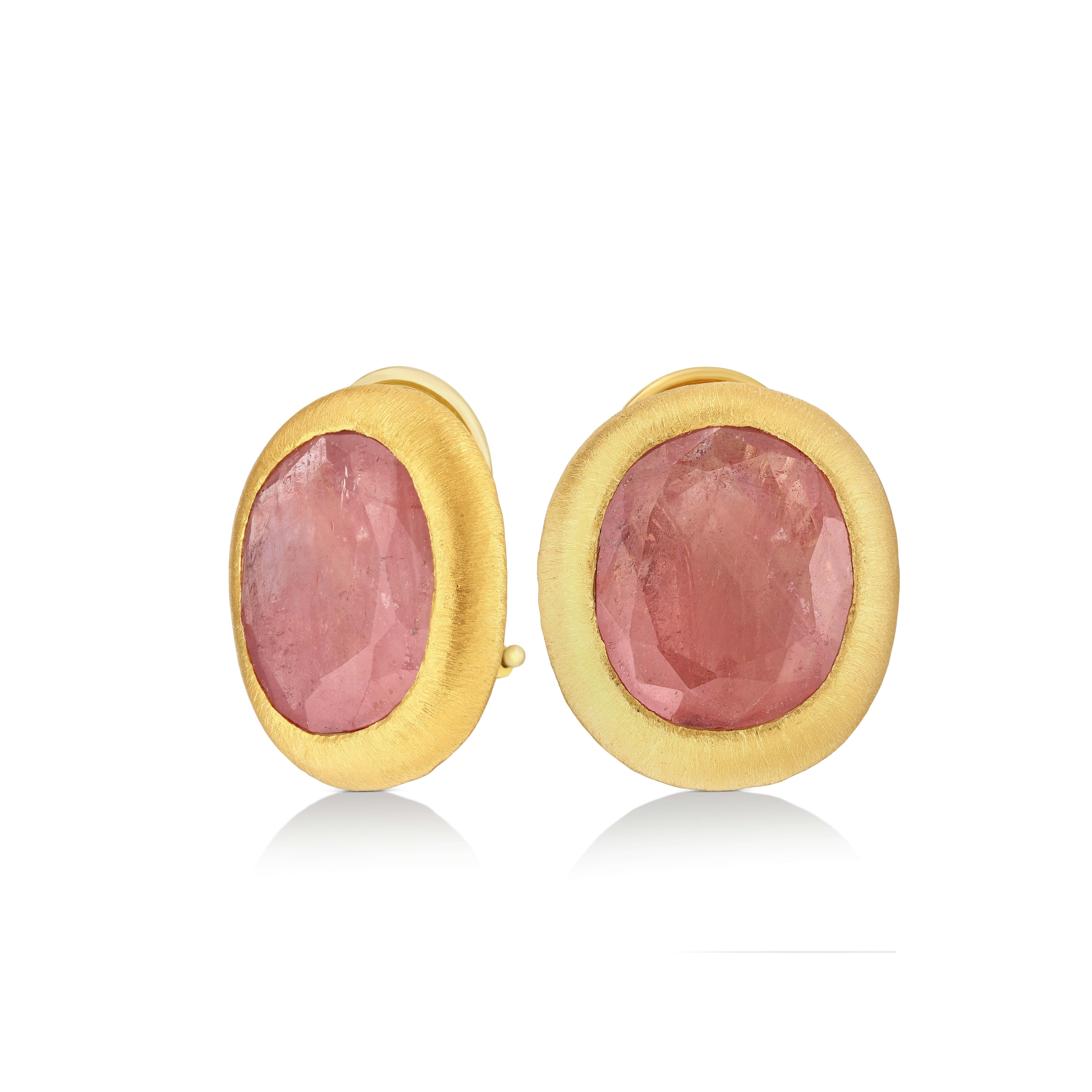 The Sapphire Stud Earrings from the Rainbow Collection by Yvel illuminate with the soft glow of dawn. Each earring is set with a 14 ct. natural sapphire, enveloped in the radiance of 18K yellow gold, reflecting the warm blush of the morning sky.