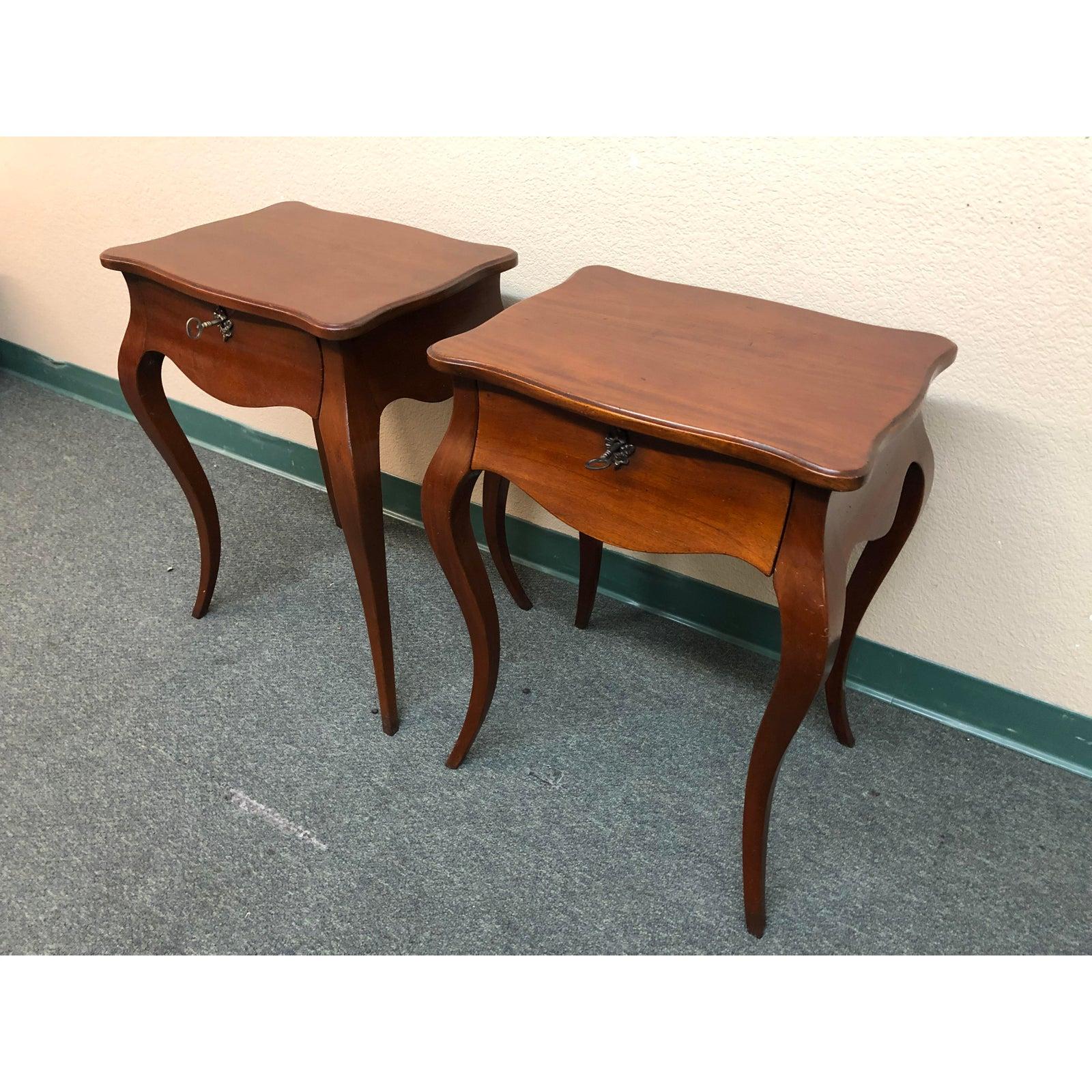 Delightful pair of side or accent tables. Referencing vintage styles the curvaceous wood top looks like it might gallop away on those gamine legs. Shallow drawer locks up your treasures, keys included. Antiqued brass fittings.

Original price