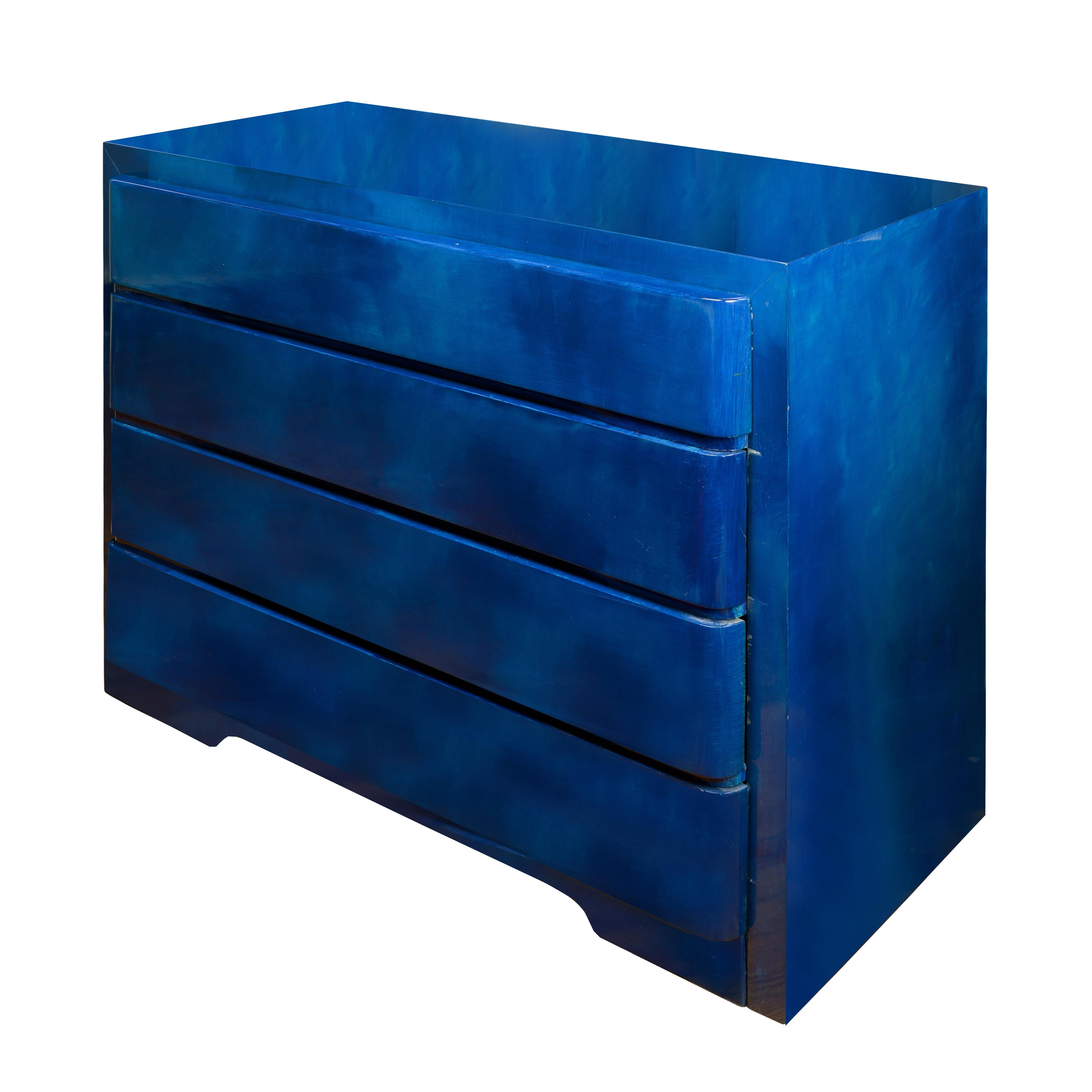 The rectangular top over four graduated drawers; on bracket feet. Blue glazing with intentional variation to color.
