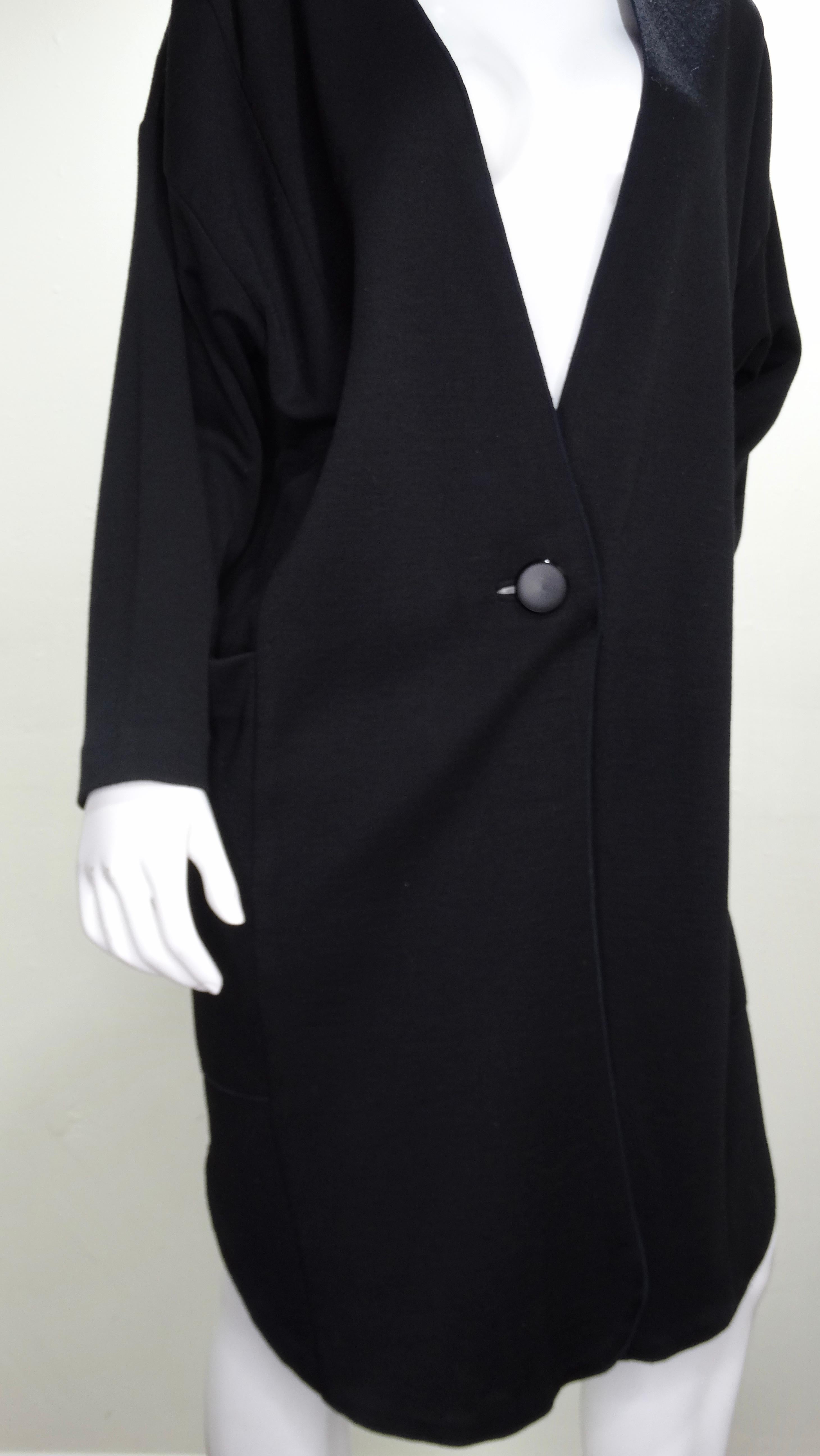 Timeless YSL long cardigan circa 1960s! Features a long sleeves, two large side pockets and a single button closure. Chic and versatile, this cardigan is perfect to wear with tights or denim and your favorite YSL bag! Sleeve: 22