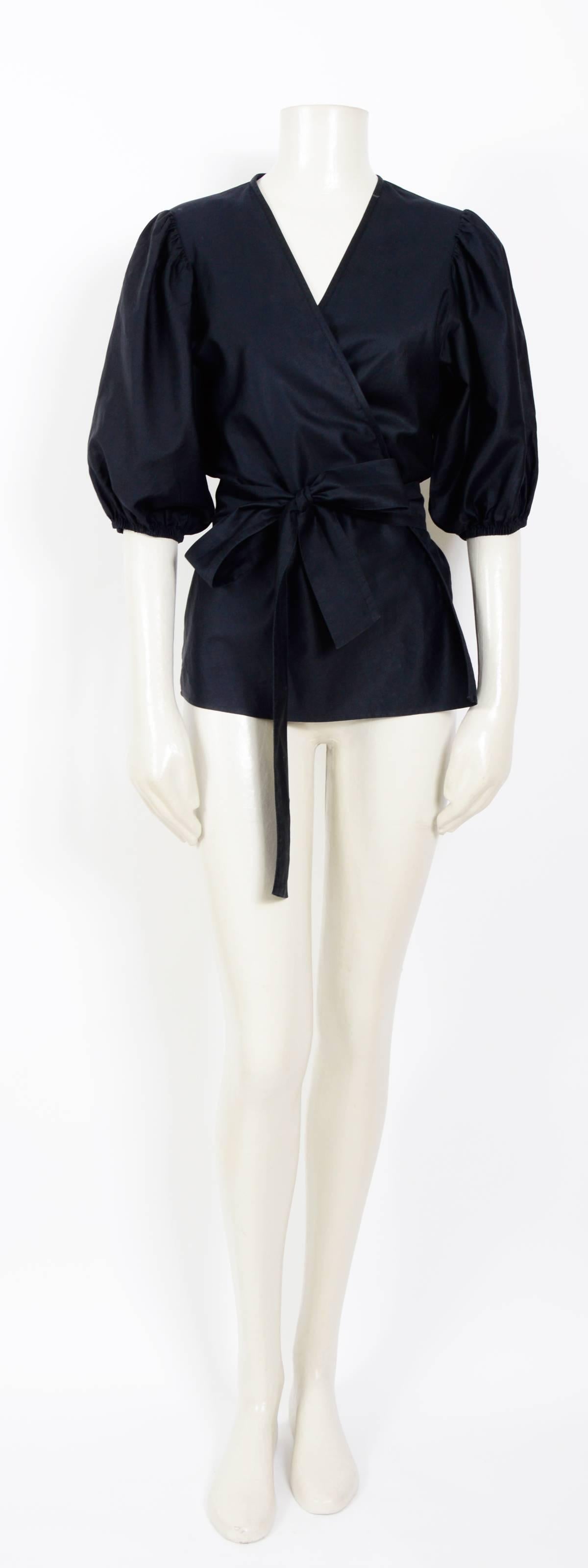 Gorgeous cotton & silk mix black wrap blouse by Yves Saint Laurent
Excellent condition
Measurements were taken flat:  Sh to Sh 14,5inch/37cm - Ua to Ua 20inch/50cm/(x2) - Waist 19inch/48cm(x2) - Total Length 25inch/83cm
