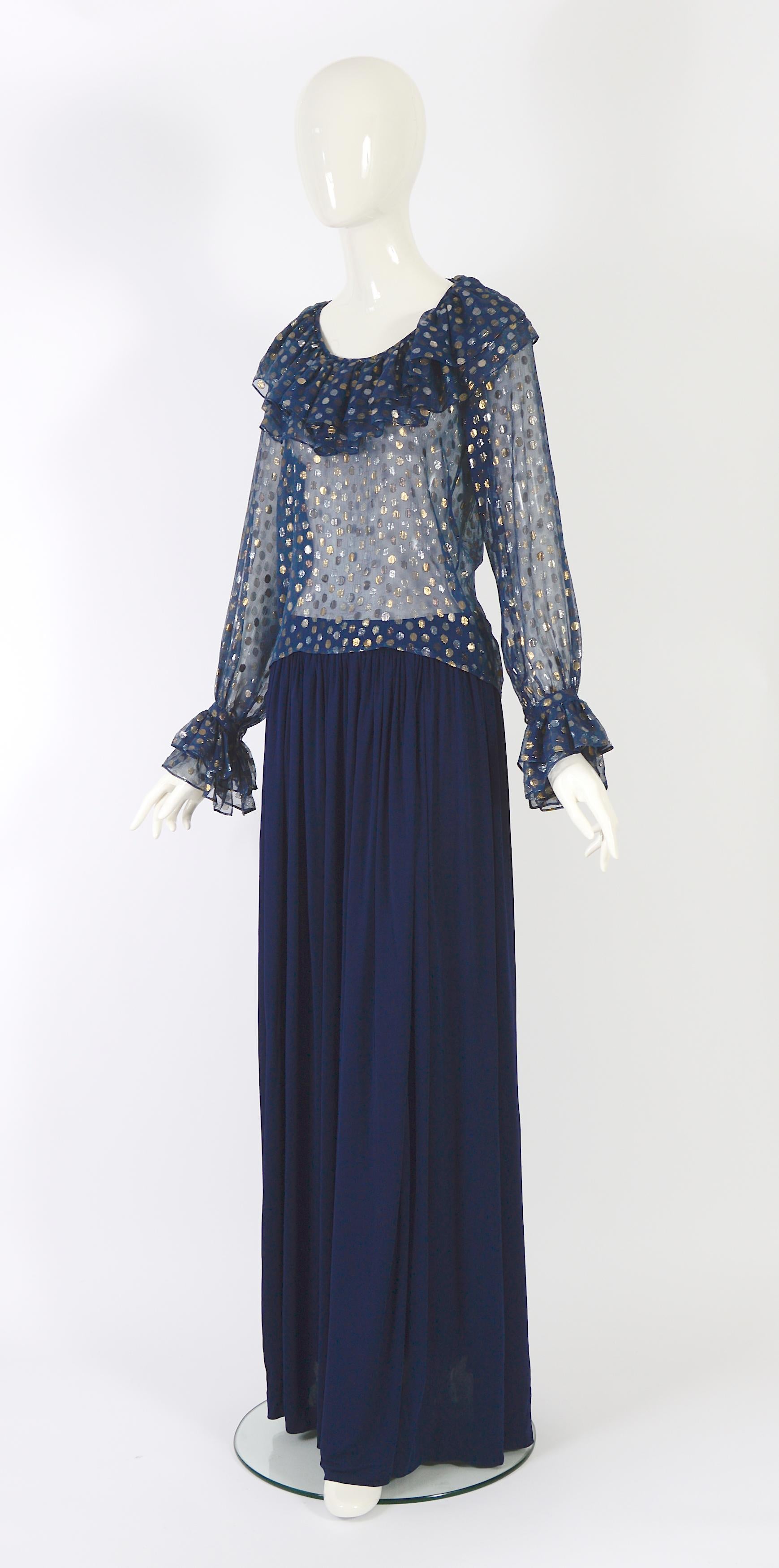 Yves Saint Laurent rive gauche 1970s blue chiffon metallic dot blouse and silk jersey skirt

The chiffon blouse features a metallic print of gold & silver dots, and blouson sleeves with layered ruffle detail at the wrists and neckline, a long blue