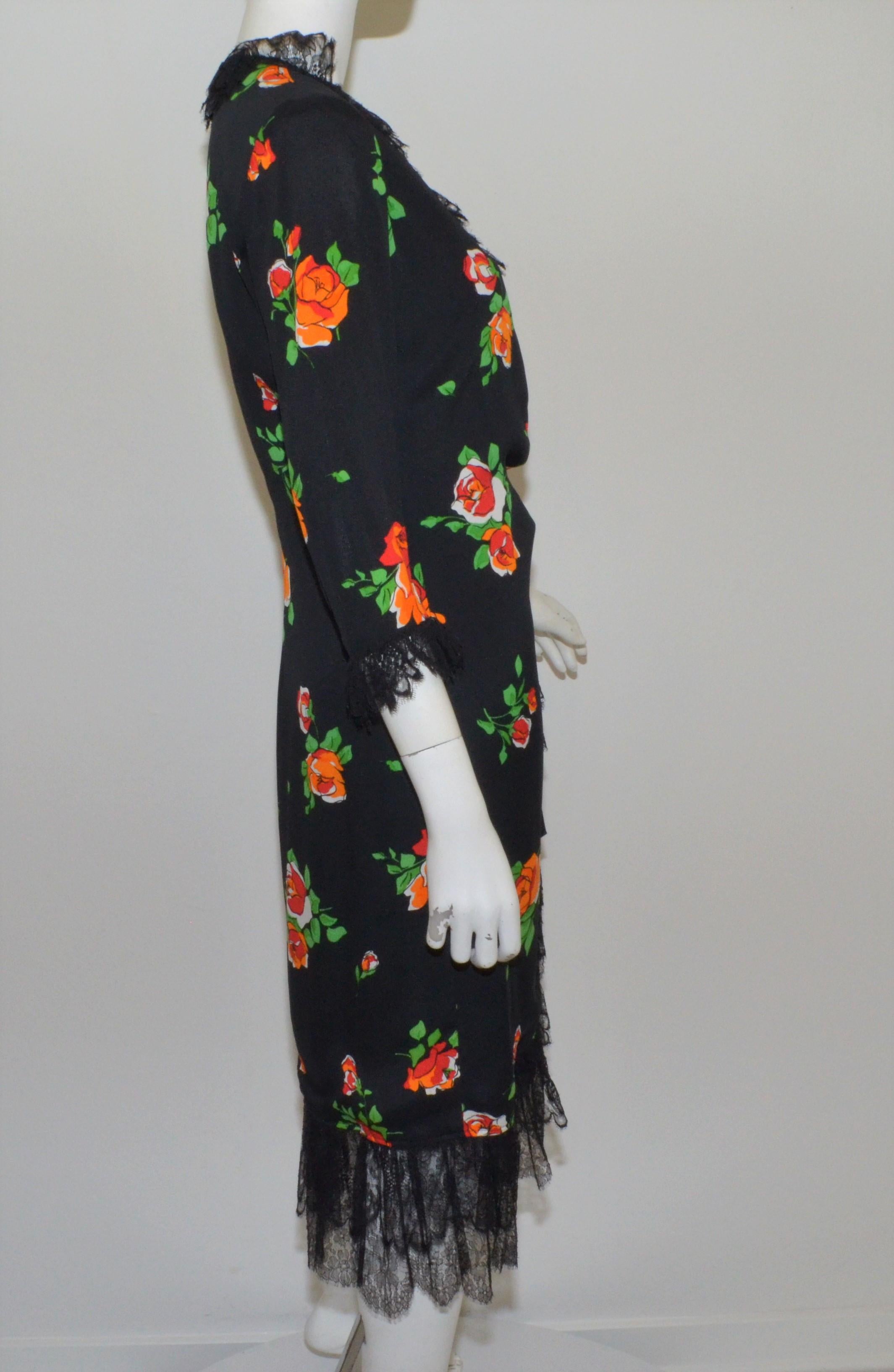 Yves Saint Laurent 1970's floral print dress features black French lace trimmings and a wrap style fastening. Dress is fully lined and is in great vintage condition. 

bust 37'',
sleeves 21''
waist 28''
hips 36''
length 46''