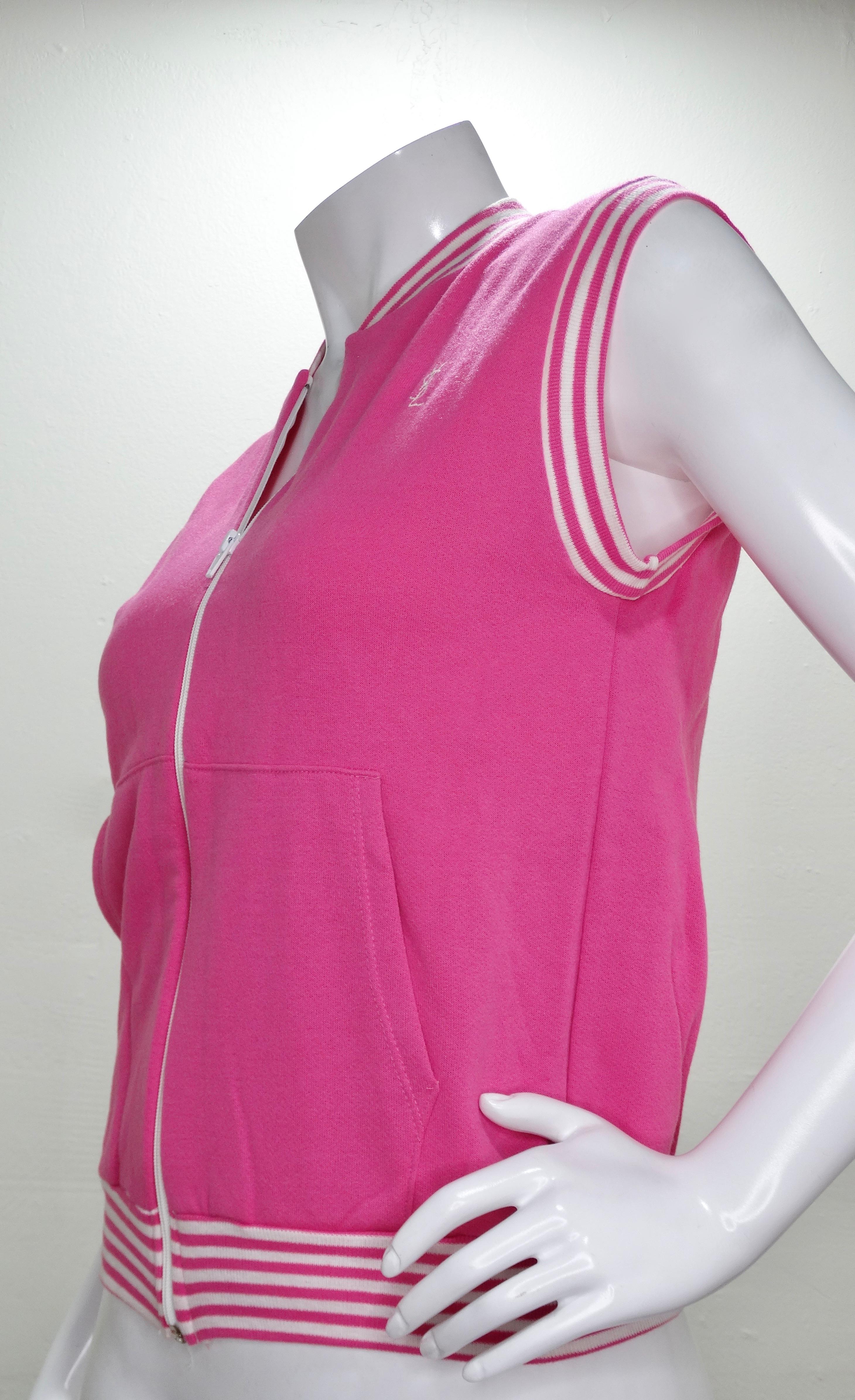 Nobody does it quite like Yves Saint Laurent! Circa early 1970s, this bubblegum pink vest from YSL's activewear line features a pink and white striped hem, YSL logo on the front, two front pockets and a white zipper closure. Original tag intact,