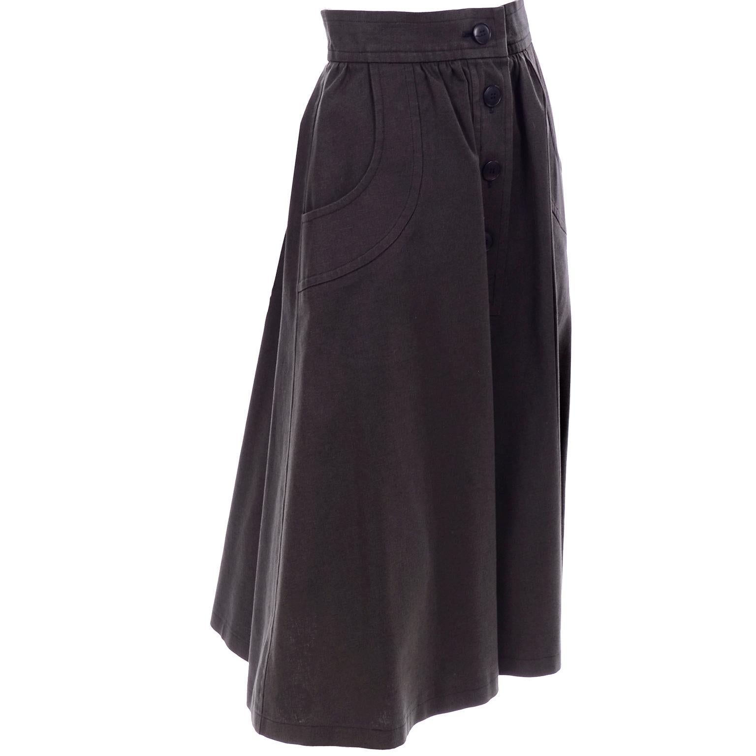 This is a vintage 1970's Yves Saint Laurent cotton flared skirt with four buttons down the front, as well as a hook at the waist. The large pockets have thick trim. The quality can be felt in this gorgeous skirt, and it has classic YSL styling. The