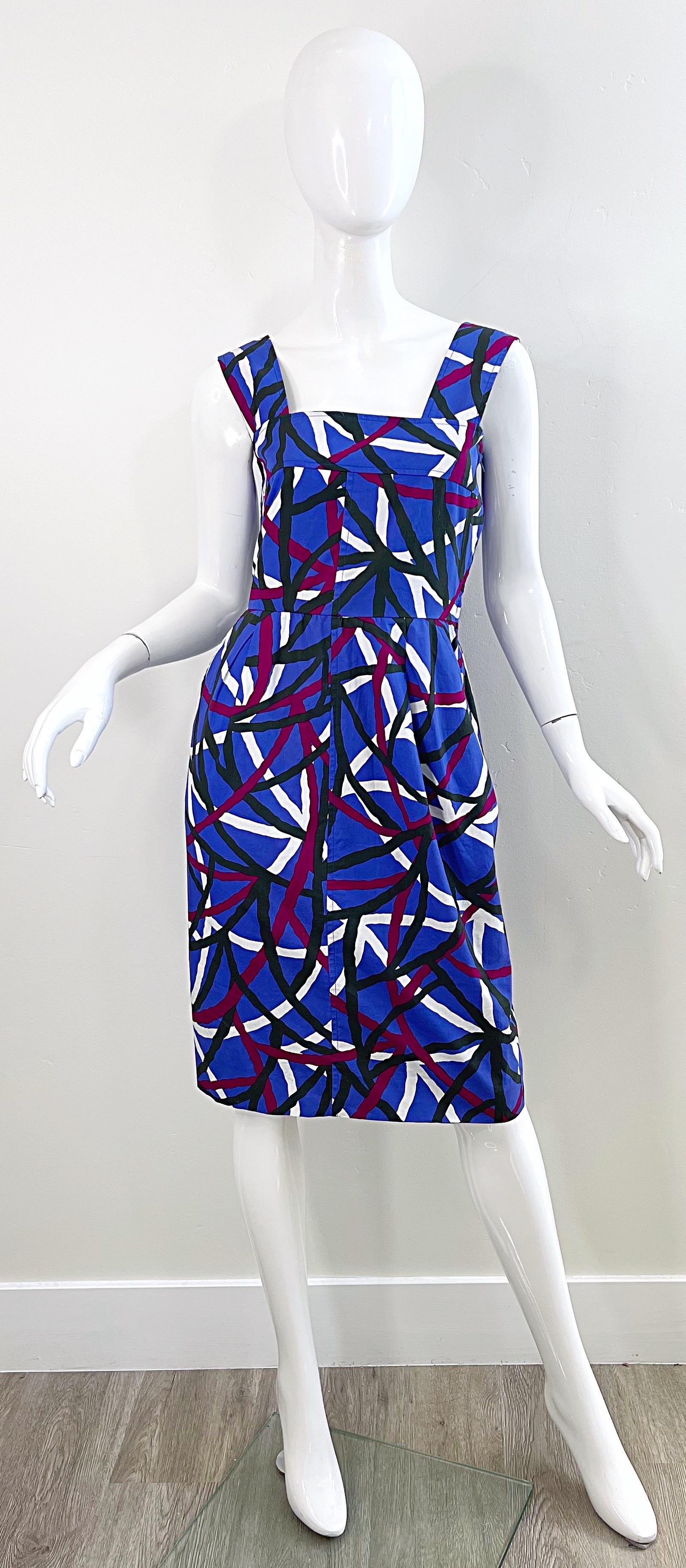 Amazing late 70s YVES SAINT LAURENT Rive Gauche graffiti print sleeveless cotton dress ! Features vibrant colors of purple, fuchsia pink, black and white. Hidden metal zipper up the side with hook-and-eye closure. Tailored bodice with a forgiving