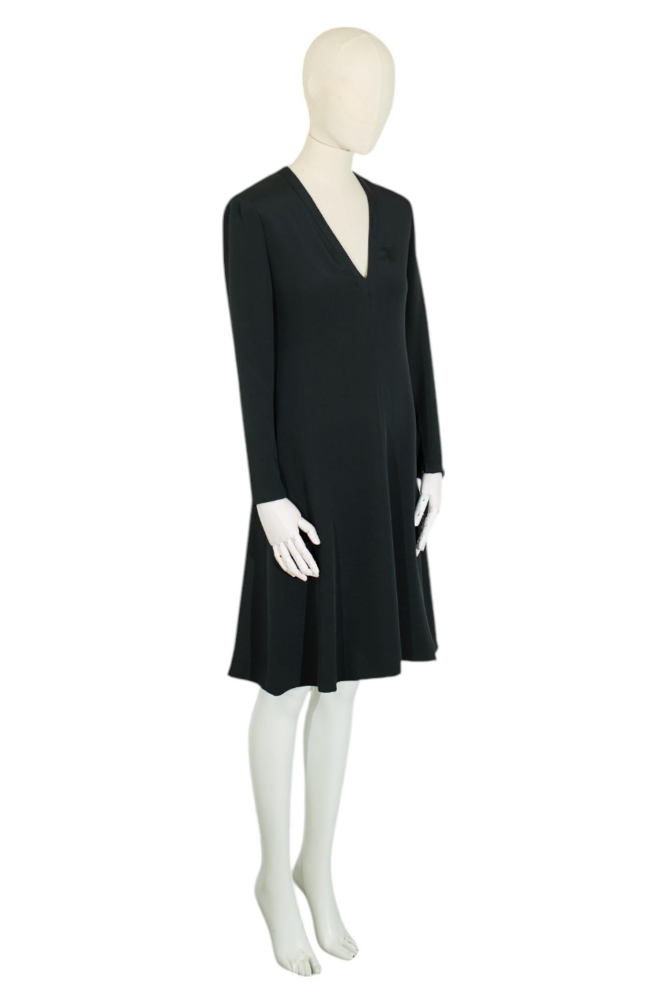 Absolutely stunning dress by Yves Saint Laurent from 1972. This dress was a made to order haute couture piece. Handmade from the finest silk. In great condition without any flaws. 
