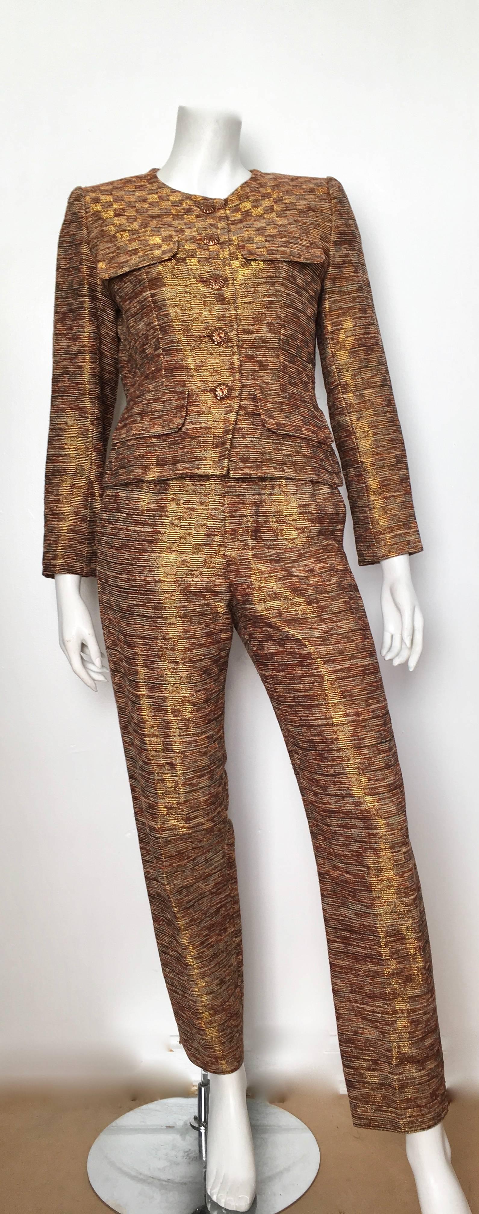 Yves Saint Laurent Rive Gauche 1980s gold / bronze silk jacket & pant suit is a French size 36 and fits a size 4. Luxurious tapestry fabric YSL 1980s pant suit is just as powerful today as when it was first designed. Jacket is fully lined, the pants