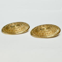 Yves Saint Laurent Gold Tone Round Clip On Statement Earrings circa 1980s