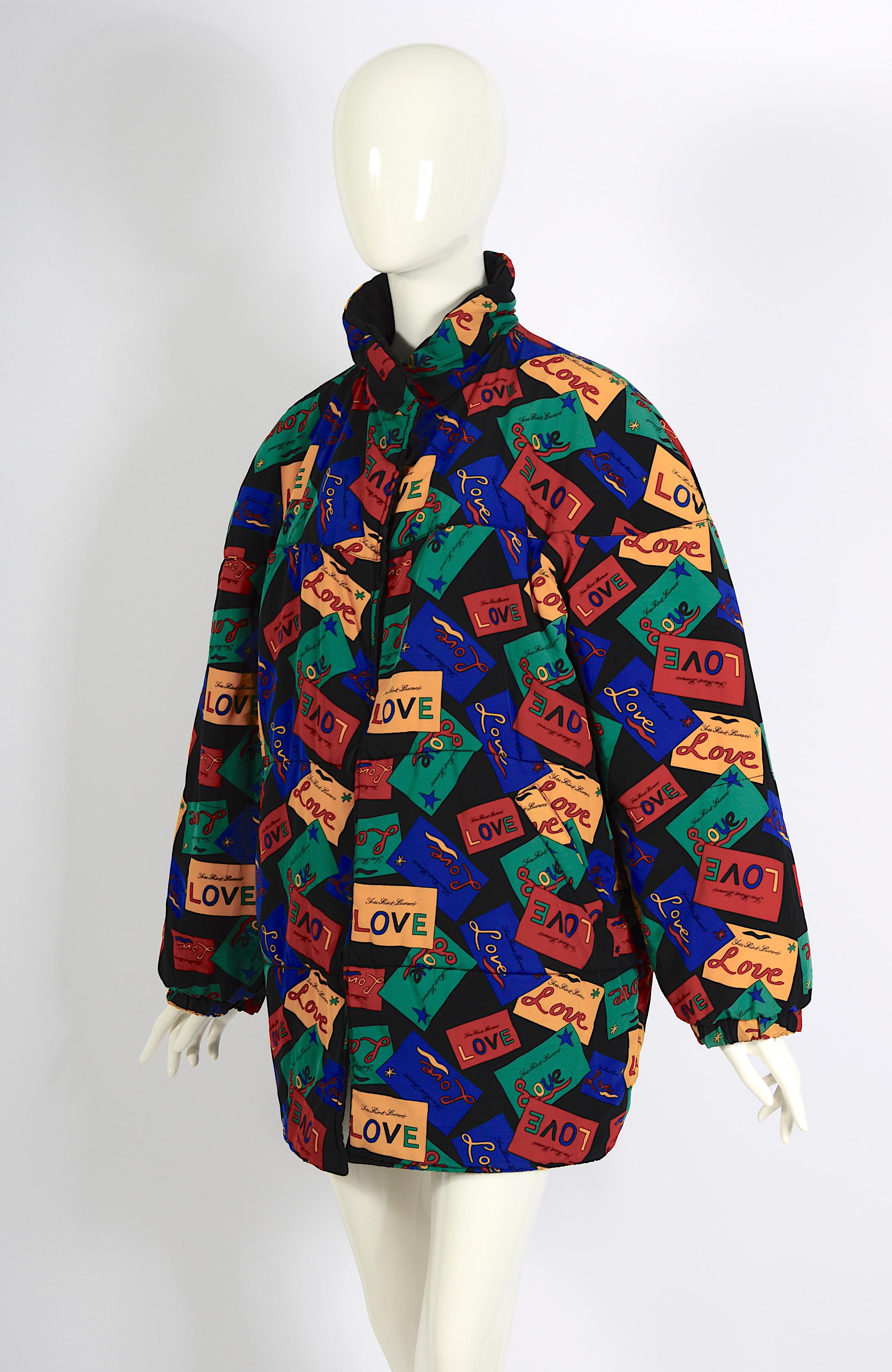 A striking and iconic Yves Saint Laurent 1980s vintage puffer coat, featuring a vibrant Love print inspired by the hand-drawn Valentine's Day signed cards Saint Laurent sent to friends. This reversible quilted coat offers versatility, with one side