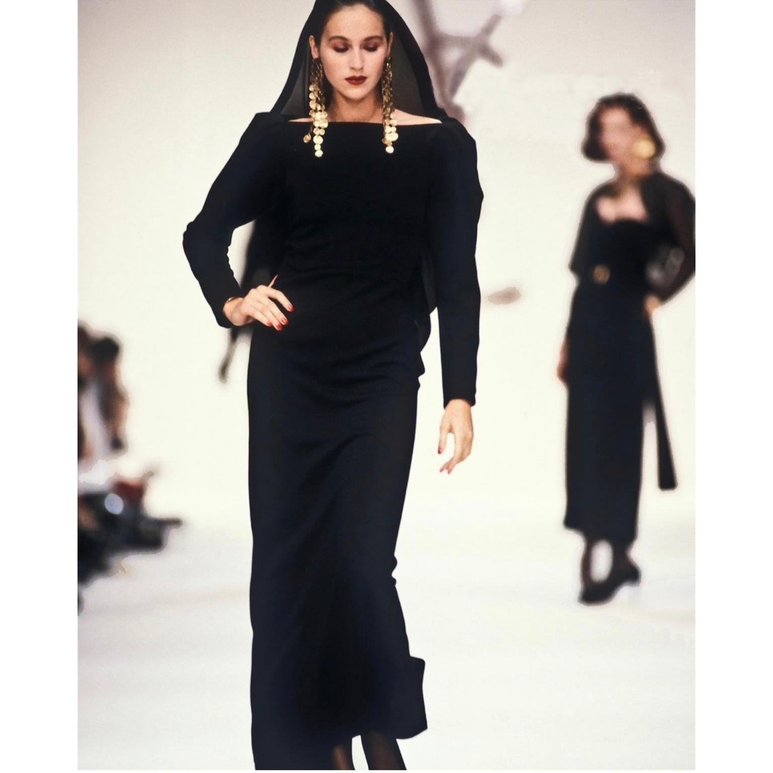 This absolutely stunning Yves Saint Laurent long black wool evening gown was featured on the YSL Fall Winter 1990/91 runway. We fell in love with this incredible dress and were are so happy to be able to include it in our YSL collection! Yves Saint