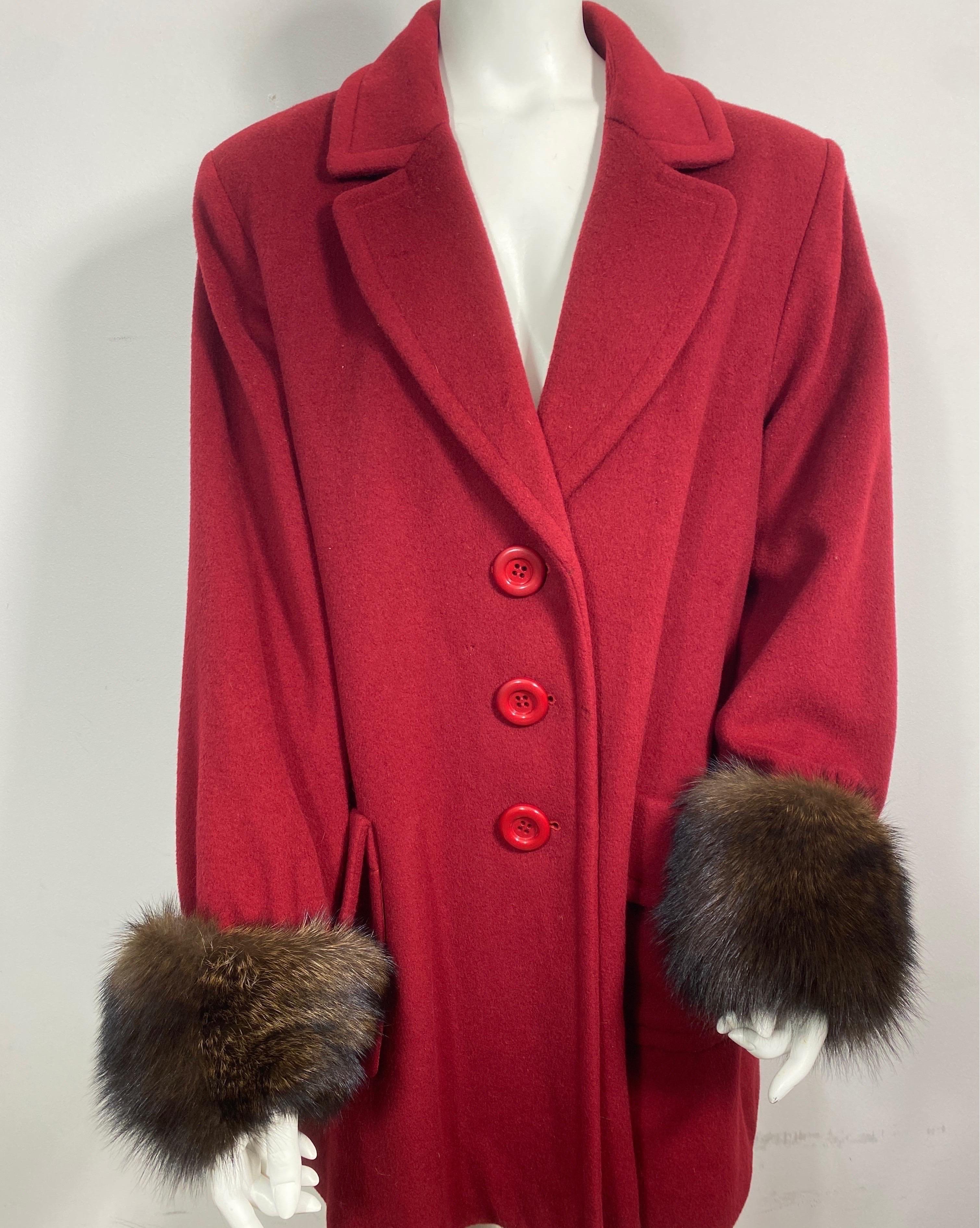 Yves Saint Laurent Garnet Cashmere and Fox Swing Coat -Size Large  This YSL Encore (Encore was specifically made for the US market) 1990’s Swing Coat is a beautiful garnet red and is fully lined. The coat has 3 front buttons, large lapels, 2 front
