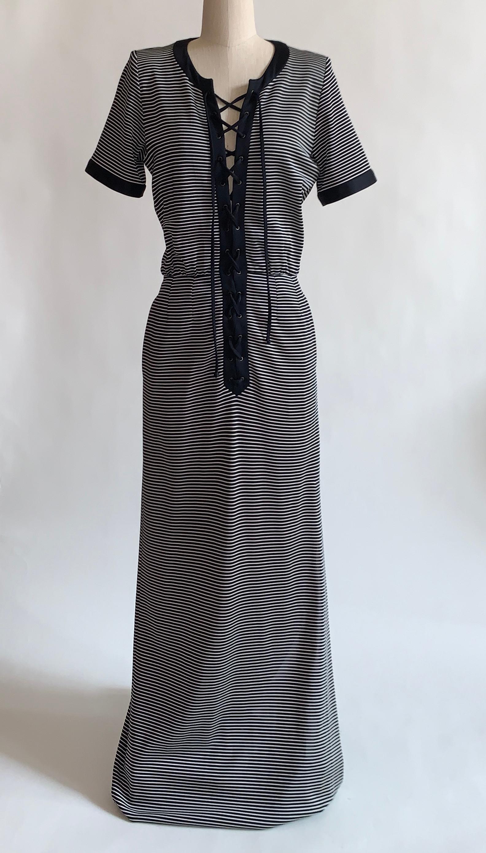1990s vintage Yves Saint Laurent Rive Guache maxi dress in a dark navy (almost black) and white stripe pattern with solid trim at neck and sleeves. Adjustable lace up front. Side pockets and slit at one side. Side zip. 

 71% acetate, 23% polyamide,