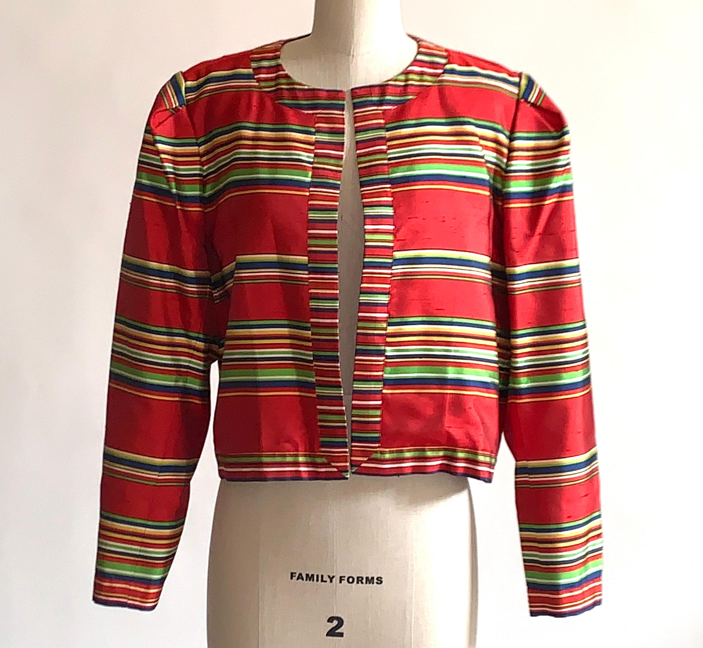 Yves Saint Laurent vintage Rive Gauche silk short jacket in red with yellow, green, blue and white stripes. Open front style. Slightly cropped with a puffed sleeve at shoulder (produced by pleating, no shoulder pads.) Beautiful natural silk slub