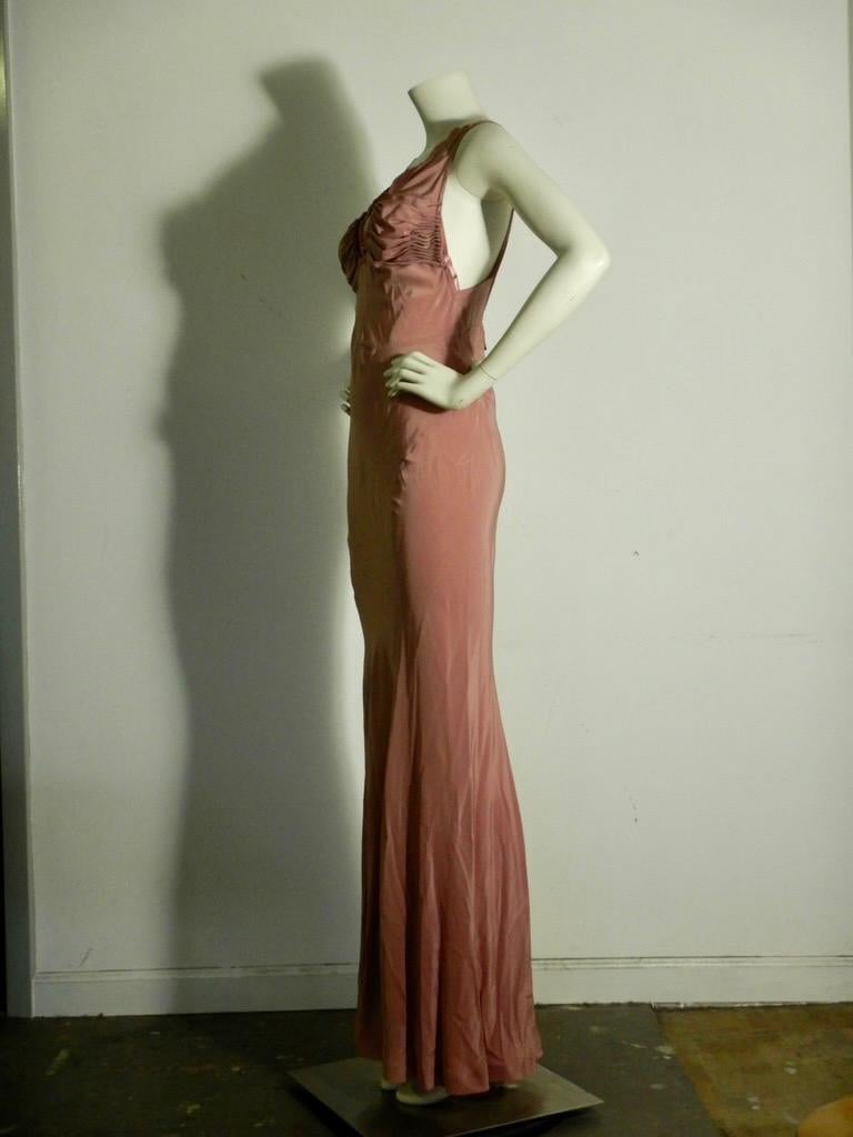 YSL dusty pink silk floor-length dress, very much in the style of 1930s glamour. 

Back zipper.

100% silk, made in France. Size F38, which generally equates to a US size small.

This is in good pre-owned condition with no holes or tears. However,