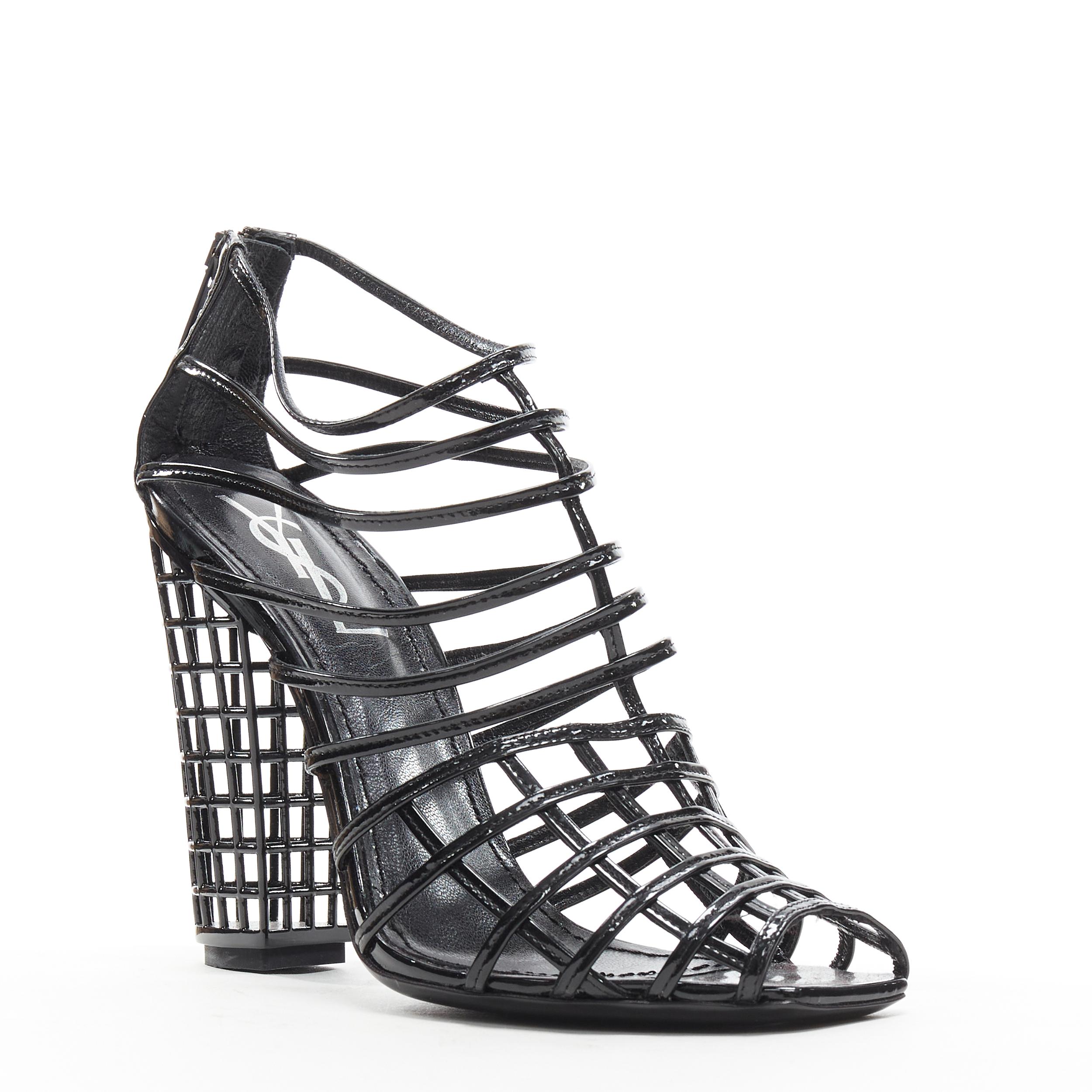 YVES SAINT LAURENT 2009 Runway Cage 110 black graphid grid patent bootie EU37 
Reference: LNKO/A01786 
Brand: Yves Saint Laurent 
Designer: Stefani Pilati 
Collection: Spring Summer 2009 Runway 
Material: Patent Leather 
Color: Black 
Pattern: Solid