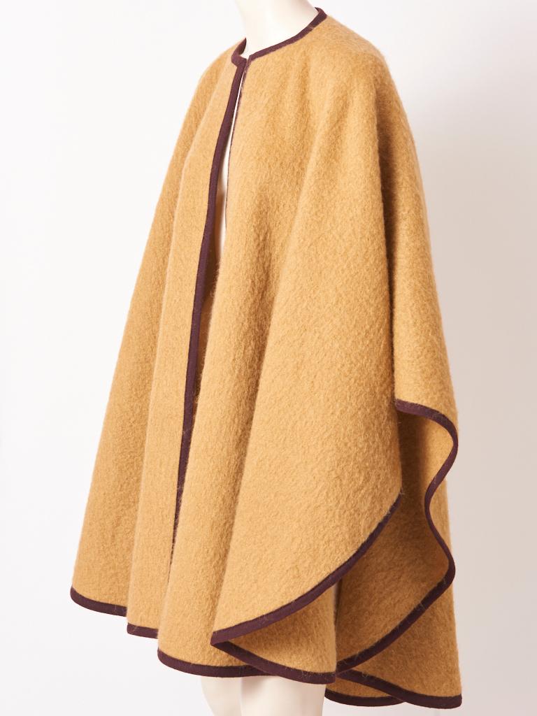 Yves Saint Laurent Rive Gauche, camel tone, wool, mohair, cape having a rich chocolate brown trim.