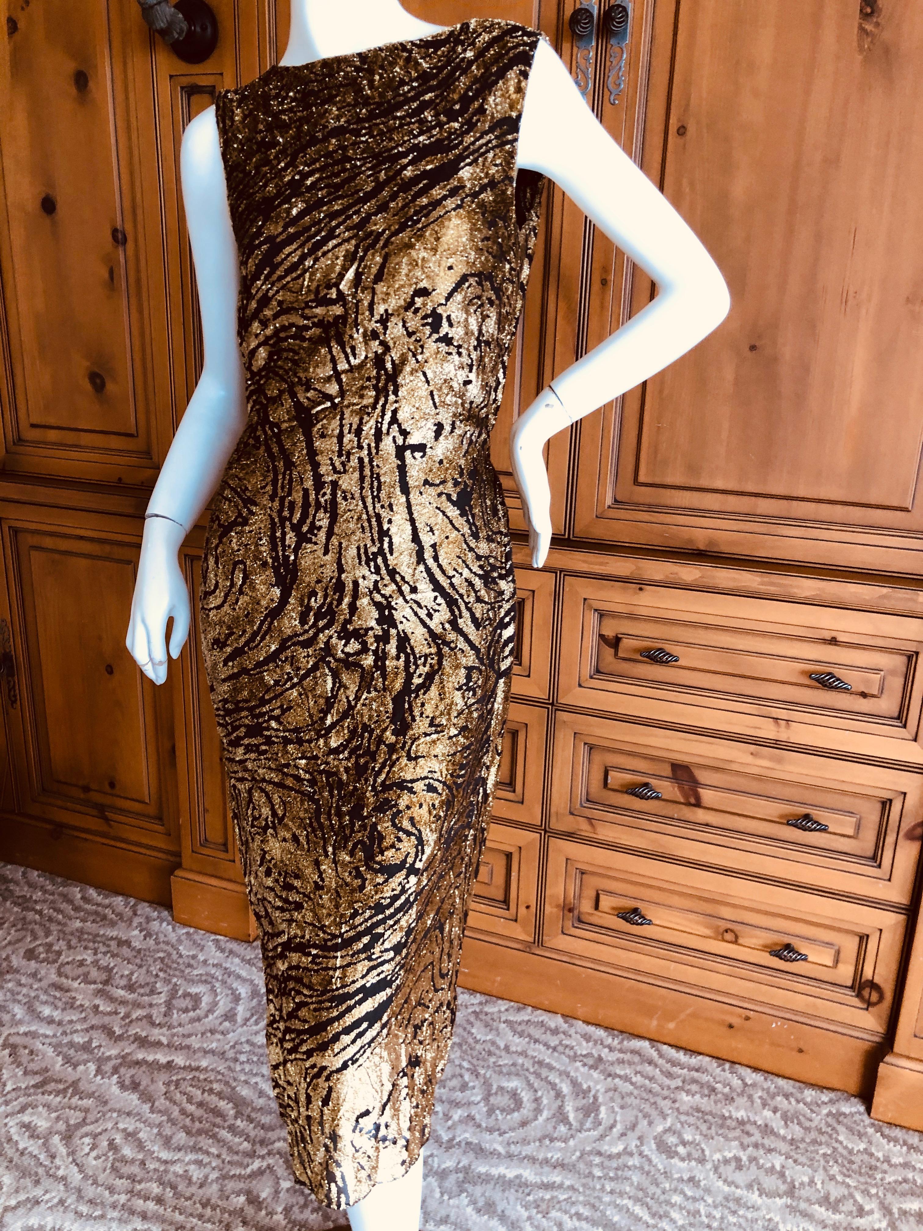 Yves Saint Laurent Rive Gauche Vintage 70's Silk Gold Lurex Animal Print Dress.
This is so pretty, it is a type of devore velvet made of silk and gold lurex.
There is a gathered elasticized waist in back. 
Size 38
 Bust 36