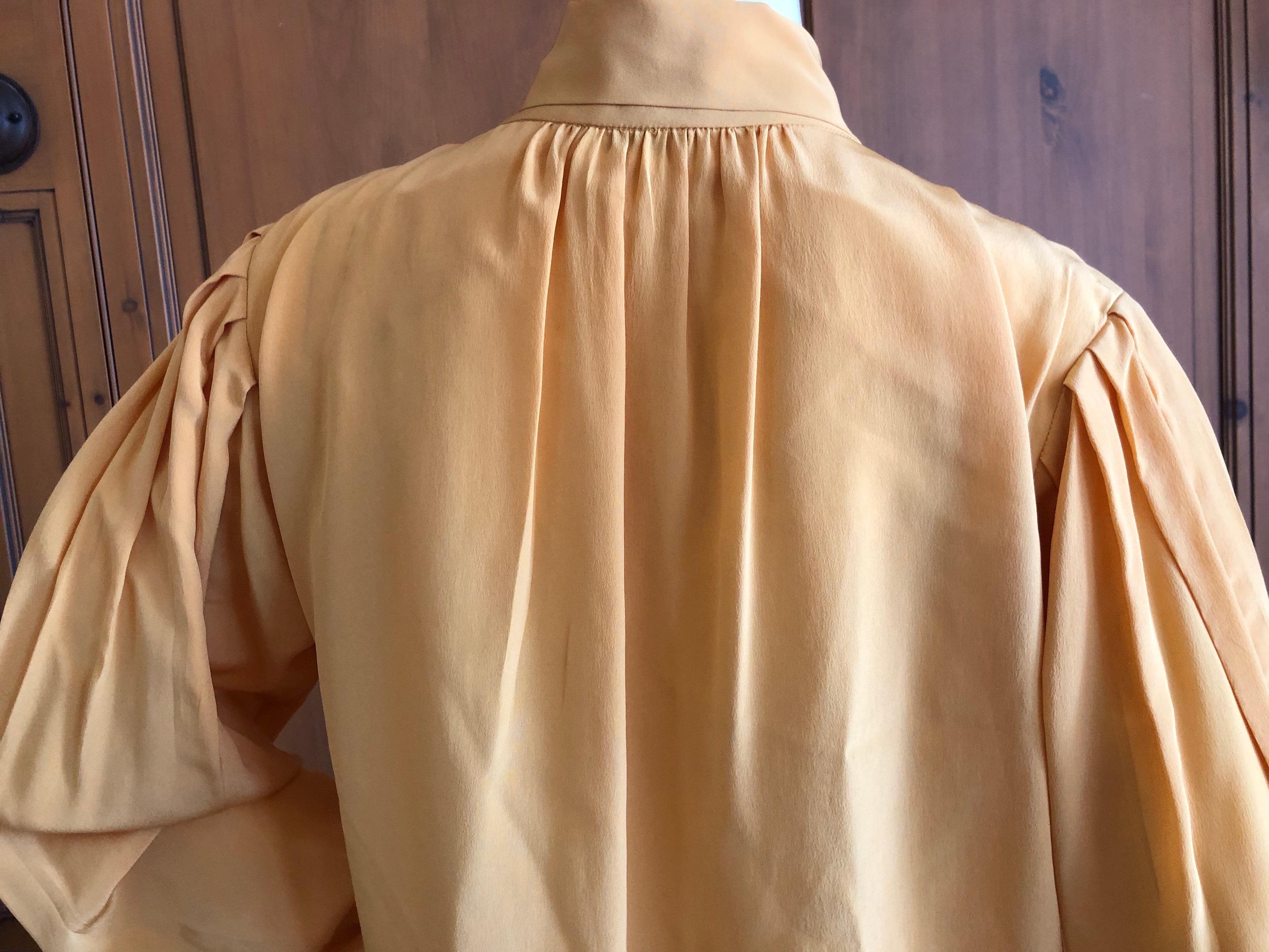 Yves Saint Laurent 70's Rive Gauche Silk Keyhole Blouse with Pussy Bow.
Size 38 but runs a little large for that size

Bust 36