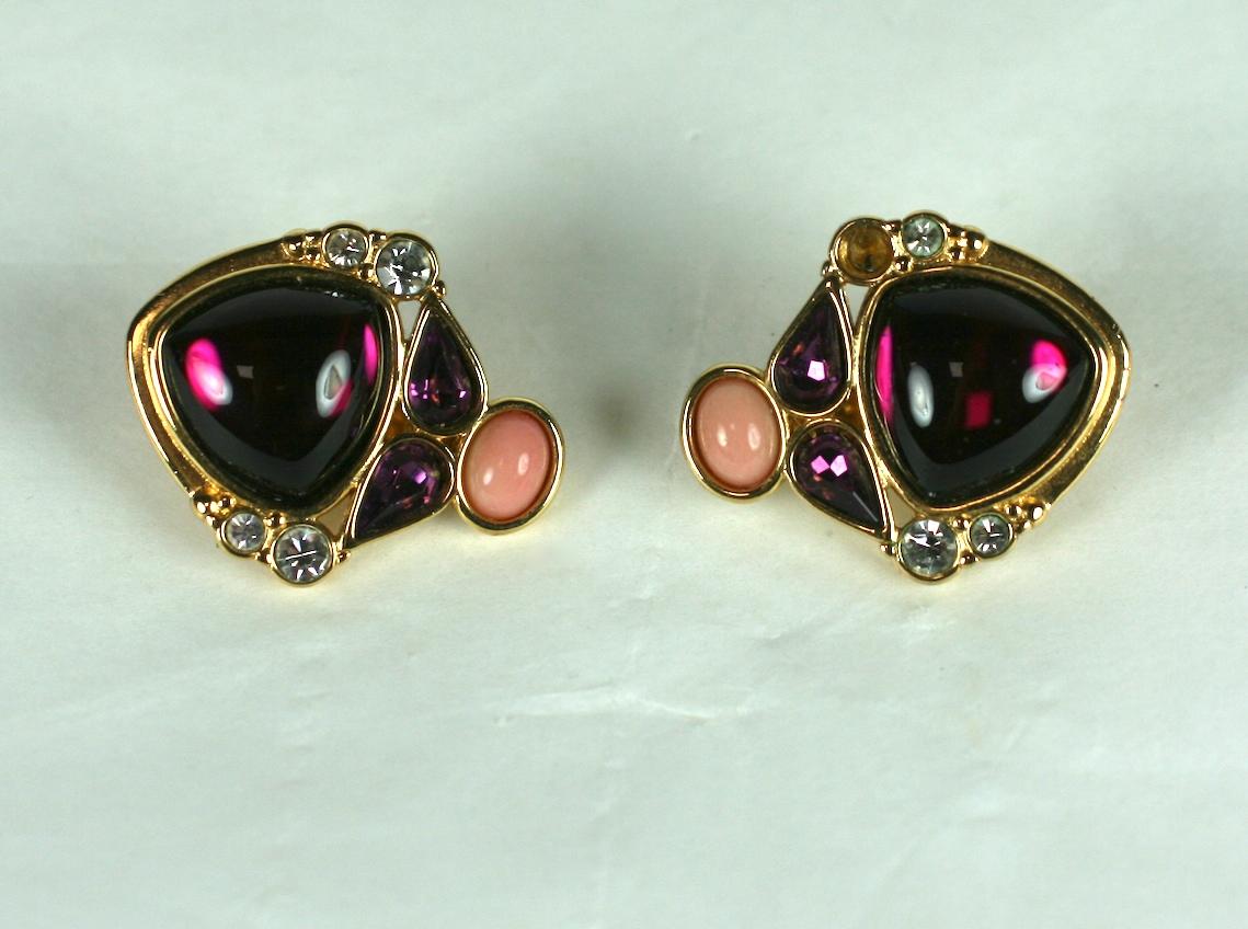 Yves Saint Laurent Clip Earrings from the 1980's set with cabochon glass stones in amythest and faux coral. Adjustable clip back fittings.  1