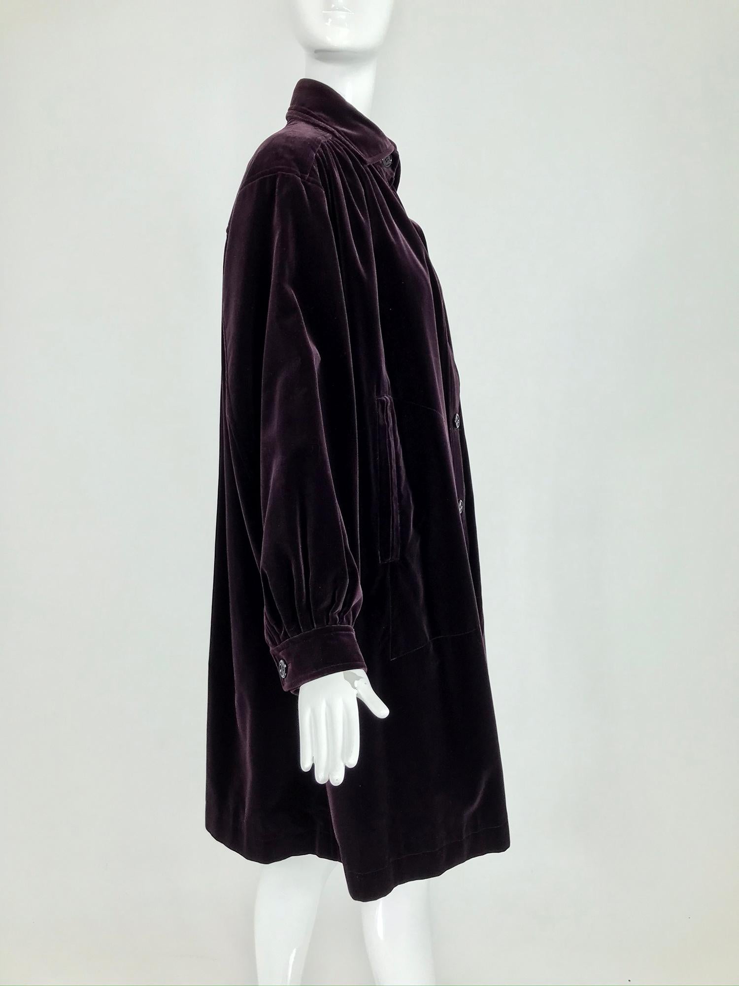 Yves Saint Laurent aubergine velvet smock coat from the 1970s. I love this coat, we've sold another in black a couple of years ago, but this colour is most amazing. Aubergine in cotton velvet, the colour changes depending on the light. The coat is a