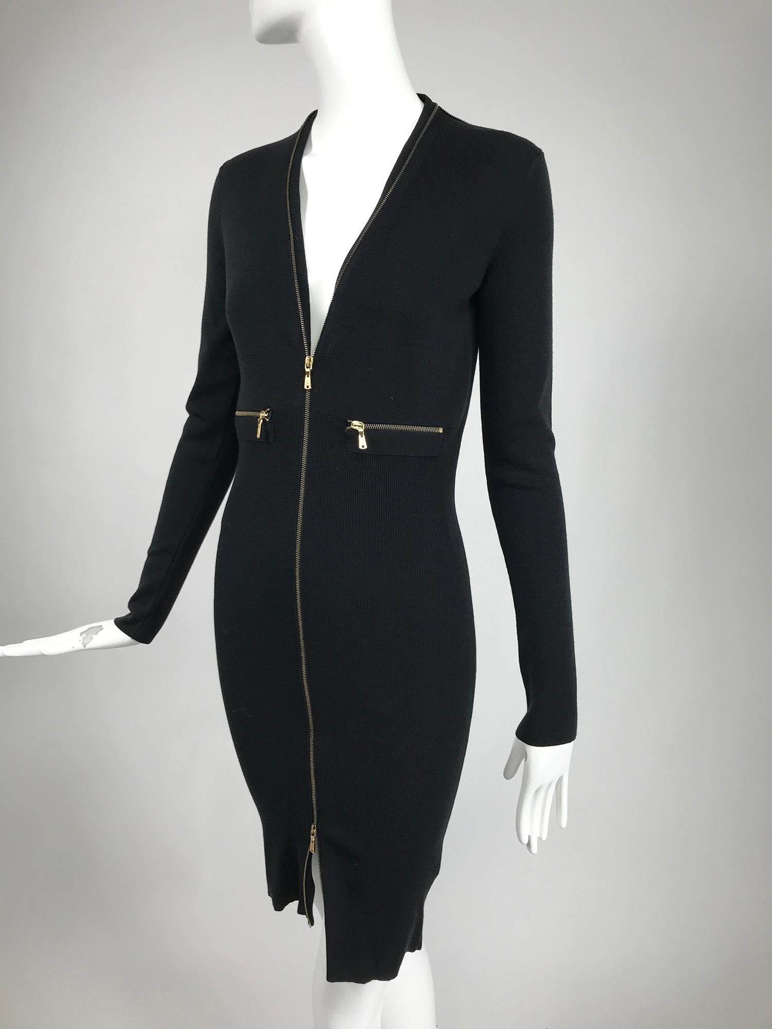 Yves Saint Laurent autumn/winter 2008 designed by Stefano Pilati, ribbed wool zipper front, body con dress. Soft black wood dress in a fine rib knit. The dress hugs the body and closes at the front with a gold metal separating zipper, each part has