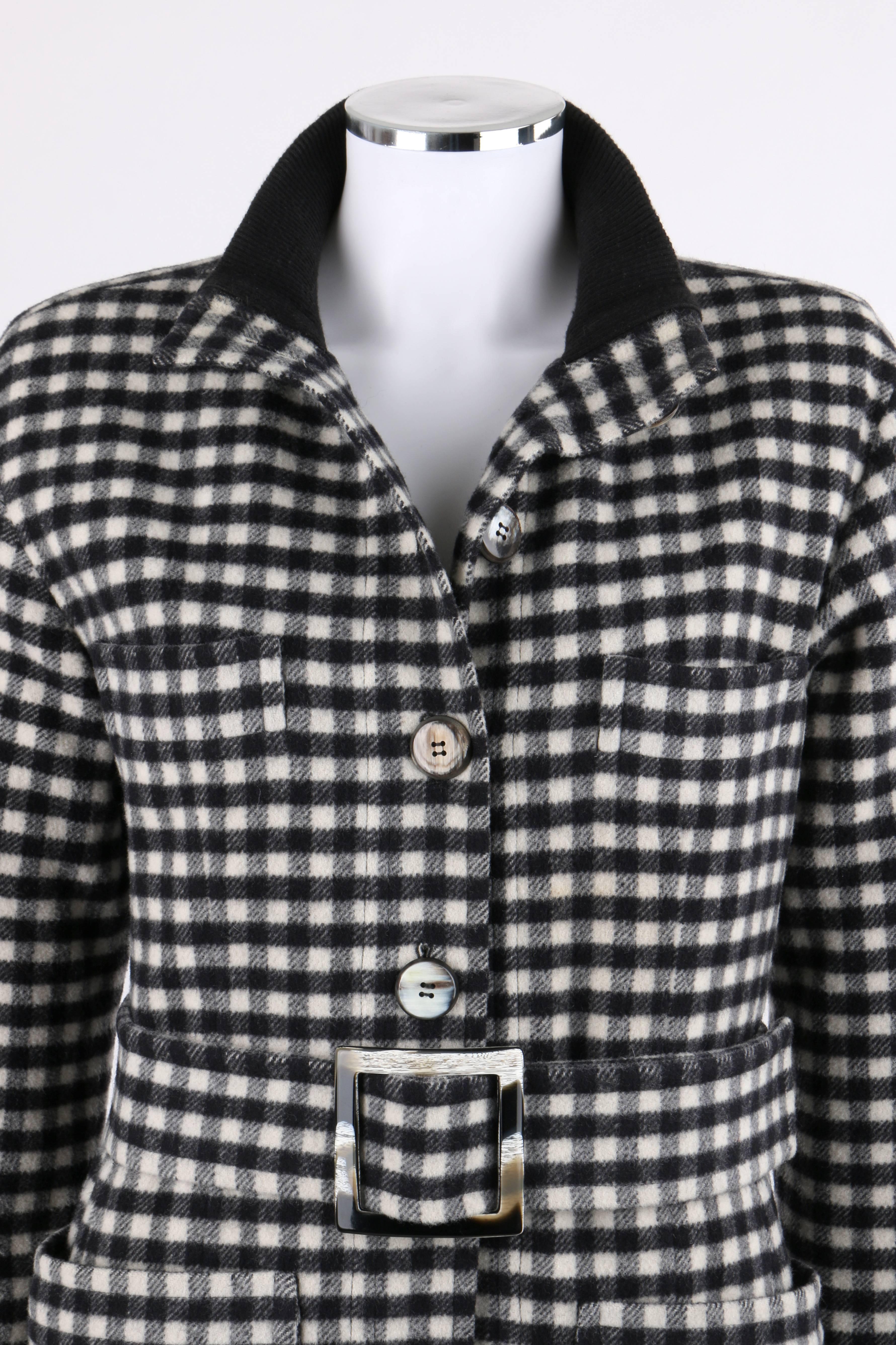 Yves Saint Laurent Autumn / Winter 1992 YSL black and white wool cashmere shepherd check belted coat. Black rib knit standing collar. Seven center front button closures. Long sleeves with black rib knit cuffs. Two single welt breast pockets. Two
