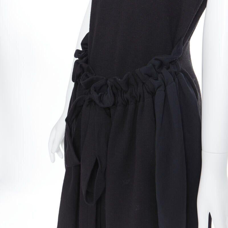 YVES SAINT LAURENT AW09 black cap sleeve ruched tie front bubble hem dress FR38
Reference: CEWG/A00011
Brand: Yves Saint Laurent
Designer: Stefano Pilati
Model: Bubble dress
Collection: Fall Winter 2009
Material: Wool, Blend
Color: Black
Pattern: