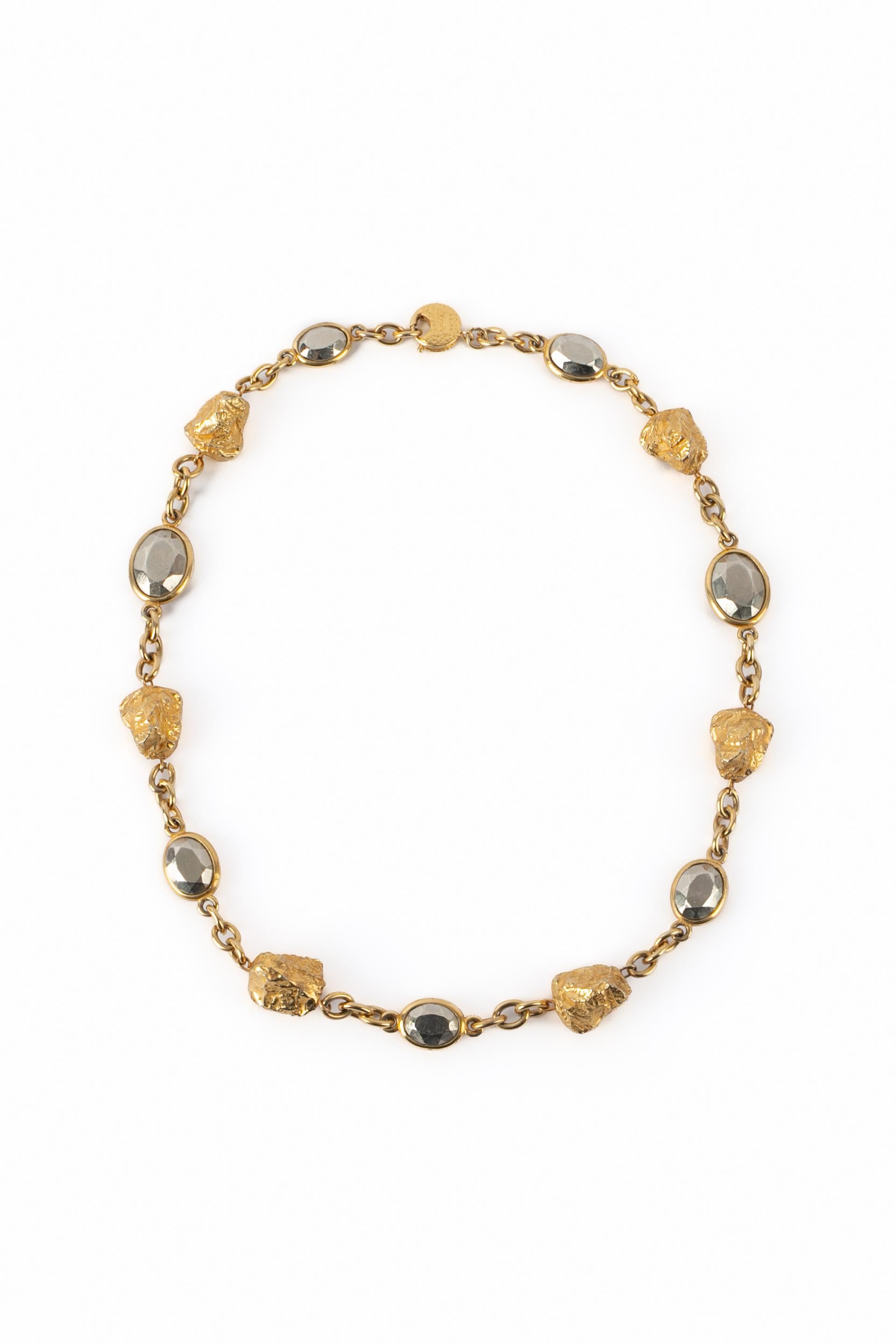 YVES SAINT LAURENT - (Made in France) Golden and silvery metal necklace.

Condition:
Very good condition

Dimensions:
Length: 70 cm

SKU:BC241