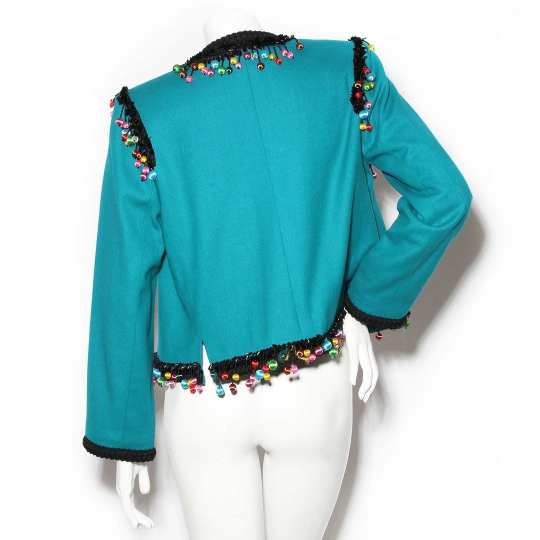 Dangling Bead Wool Jacket by Yves Saint Laurent
H 1991
Made in France 
Turquoise wool with black and multicolor ball beads 
Black braided trim 
Lightly padded stiff shoulders
One top button closure  
100% Wool
100% Acetate lining 
Good vintage