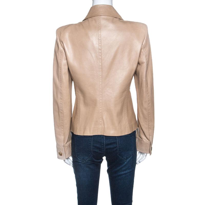 This lovely jacket is designed by Yves Saint Laurent from leather. Designed with long sleeves, the beige creation comes with pockets, silk lining and front buttoned closure. Detailed with ruffles, it will be your style companion all year long.

