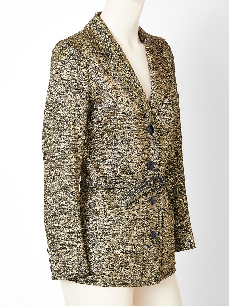 Yves Saint Laurent, Rive Gauche, synthetic tweed, and gold lurex belted blazer having a narrow fit, with  notched lapels, and deep flap front pockets. C. late 70's.