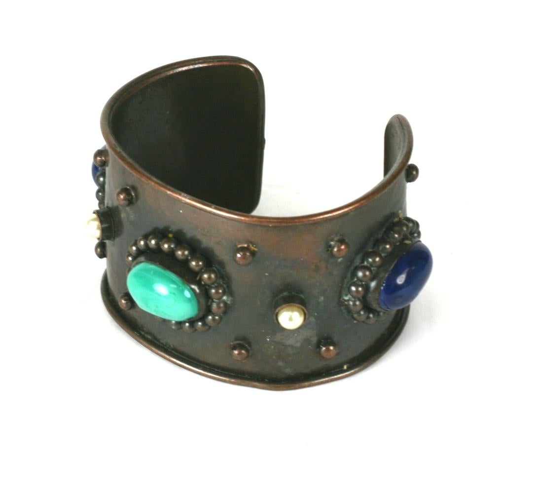Yves Saint Laurent Haute Couture Berber style cuff bracelet of bronze finished patanaed copper with oval faux turquoise and lapis pate de verre cabochons and faux pearls. Bronze granulated bead applied decoration. Made by Maison Goossens, 1970's
