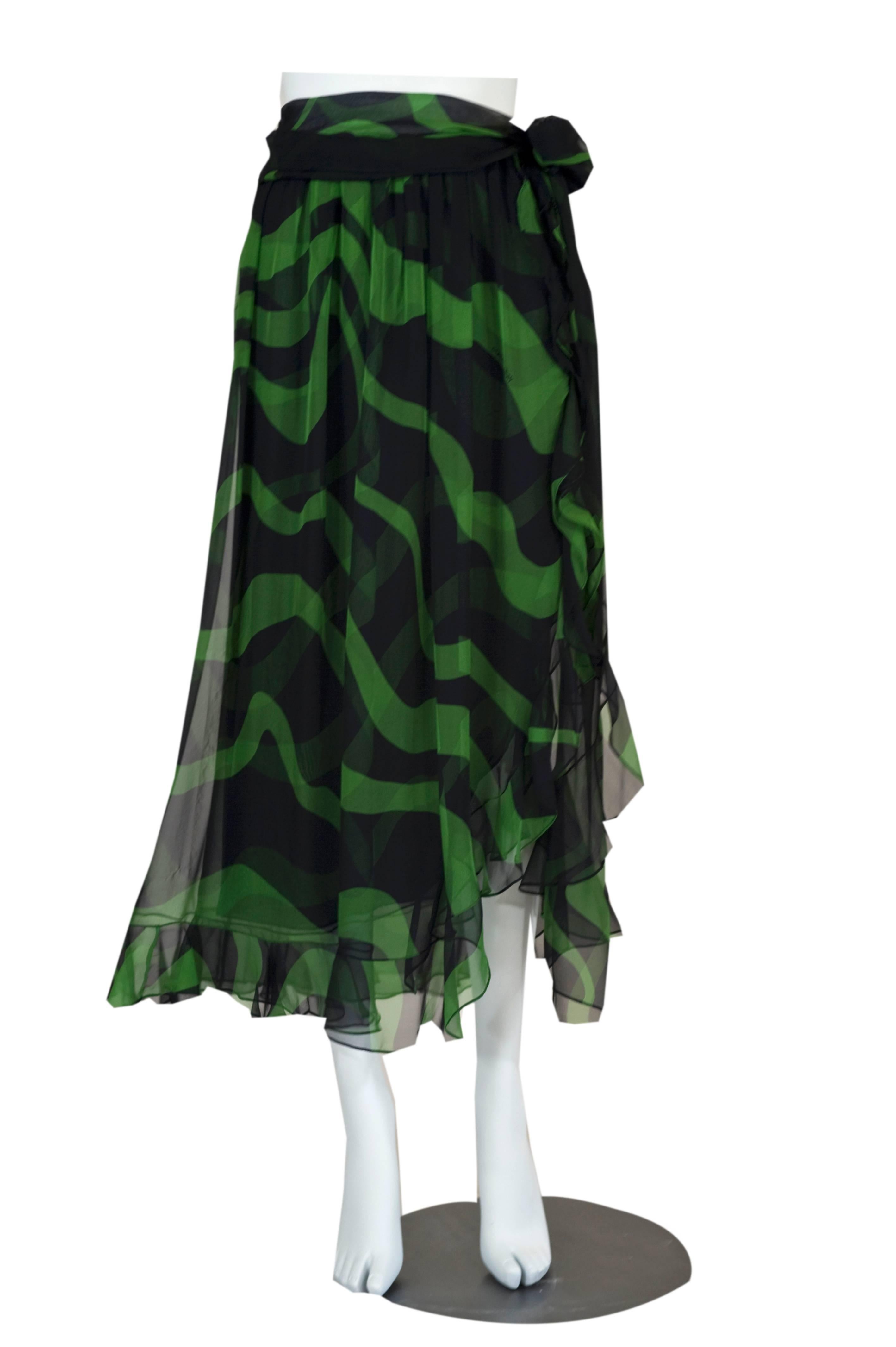 This is a fabulous  YSL silk  flamenco skirt. Made of fine lightweight airy silk chiffon that feels incredible against the body. I love the midnight black and green abstract swirl pattern. The skirt is finished in a ruffled edge that cascades down