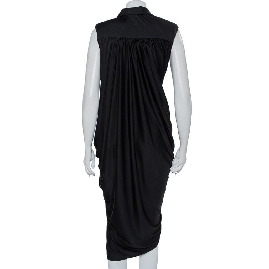 Sure to add a whole lot of style to your wardrobe, this sleeveless dress from YSL is worth the buy! The black knit creation features a flattering silhouette with an asymmetrically draped hemline. It has been designed with a collared neckline and