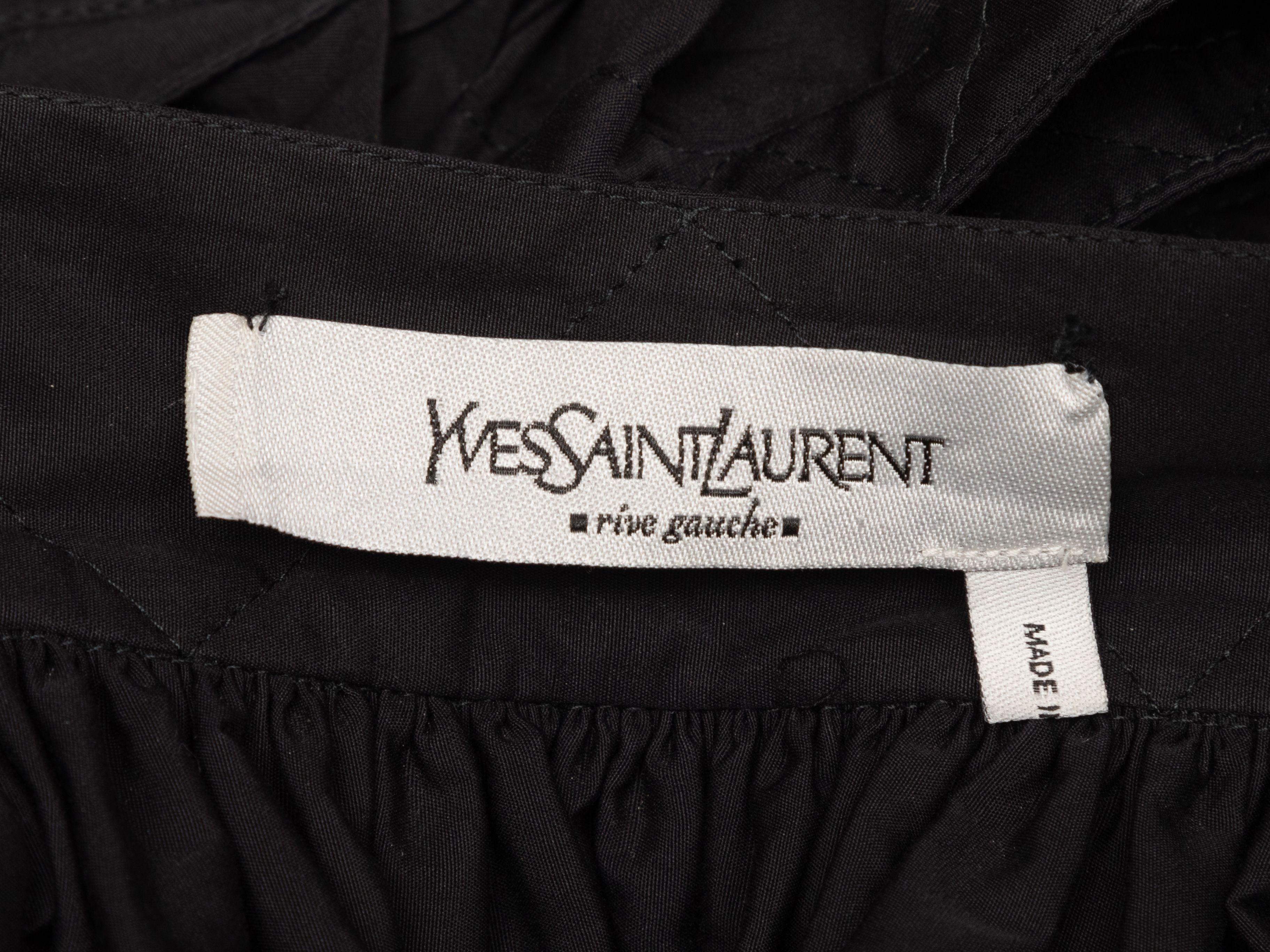 Product Details: Black cotton halter midi dress by Yves Saint Laurent. V-neck. Ruffle trim at neckline. Sash tie at waist. 26
