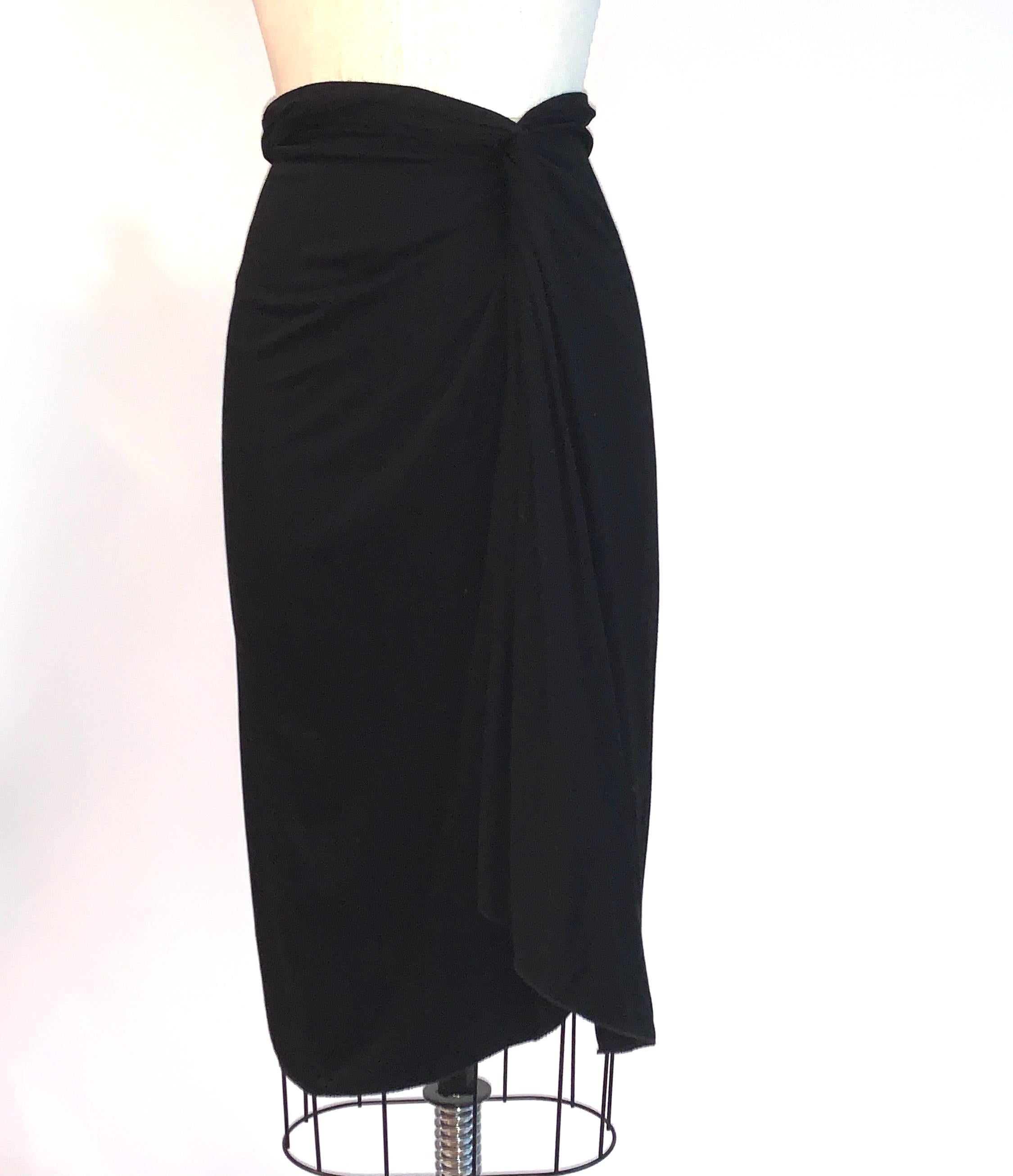 Yves Saint Laurent black matte jersey pencil skirt with great twist and drape detailing at front side waist. Soft, comfy, and very versatile! Back zip and hook and eye.

100% viscose. (Unlined.)

Made in Italy. 

Size IT 40, best fits US 2/4, see